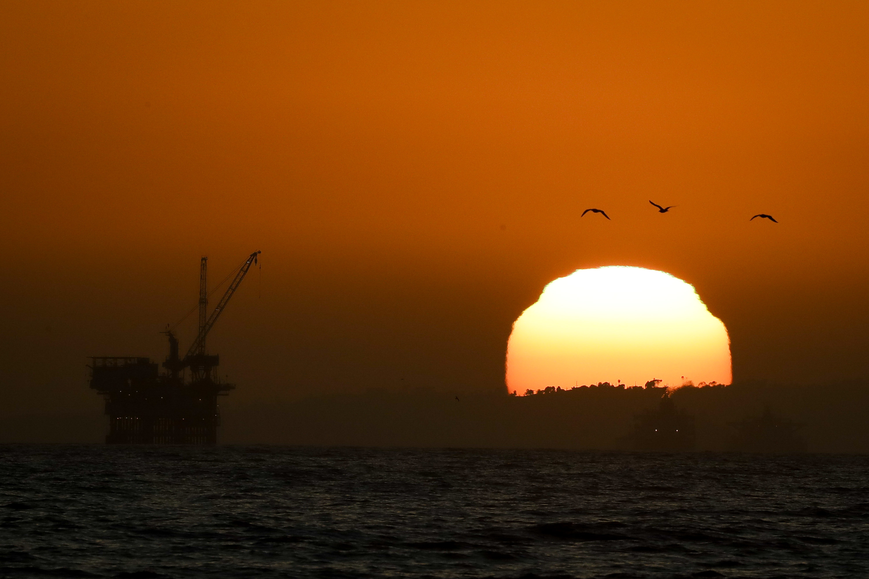 Offshore oil drilling platforms are seen Tuesday, April 21, 2020, in Huntington Beach, Calif. Oil prices continue to drop, because very few people are flying or driving, and factories have shut amid widespread stay-at-home orders due to the coronavirus concerns. (AP Photo/Chris Carlson)