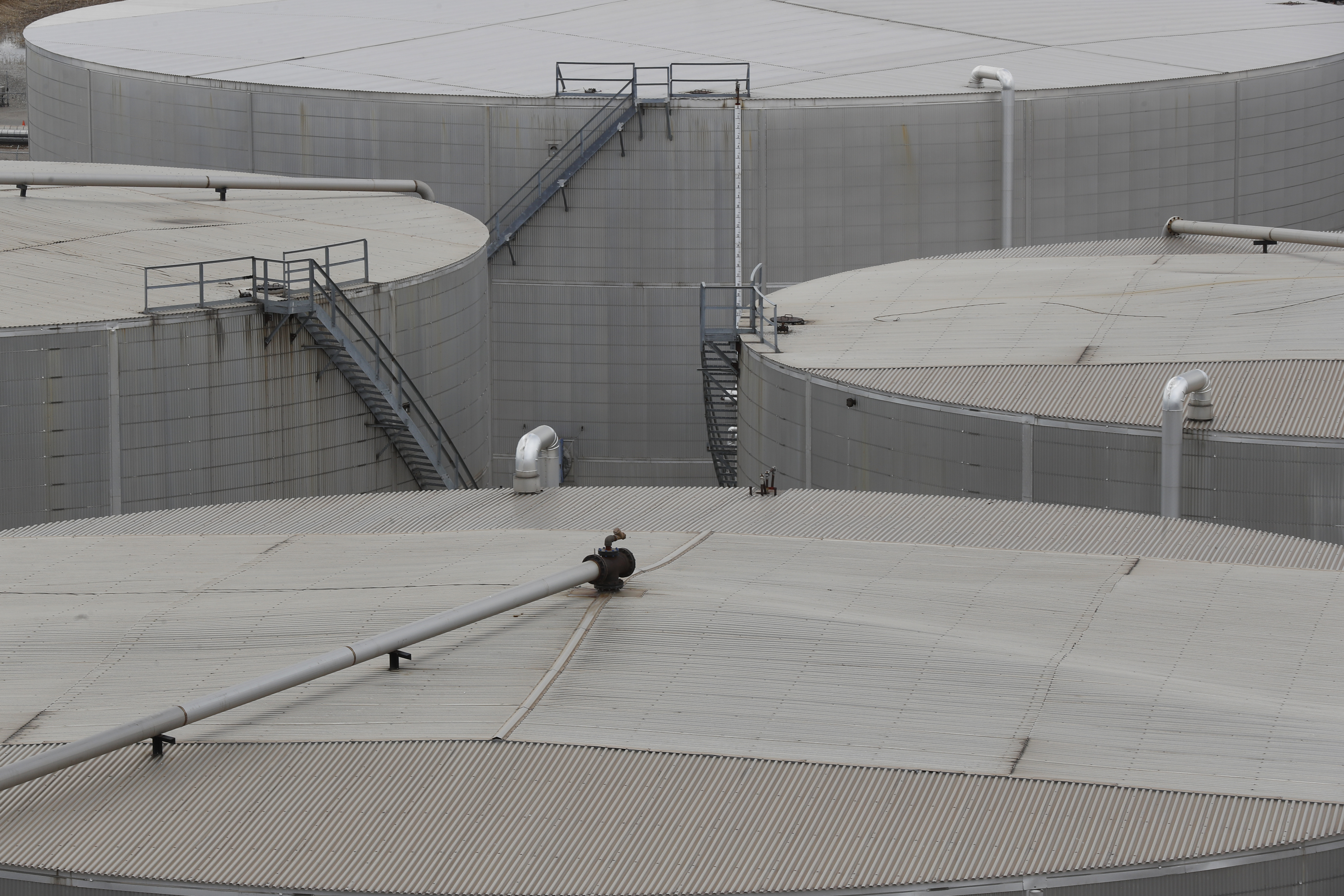 Storage is shown at the Marathon Petroleum Corp. refinery in Detroit, Tuesday, April 21, 2020. The world is awash in oil, there's little demand for it and we're running out of places to put it. That in a nutshell explains this week's strange and unprecedented action in the market for crude oil futures contracts, where traders essentially offered to pay someone else to deal with the oil they were due to have delivered next month.(AP Photo/Paul Sancya)