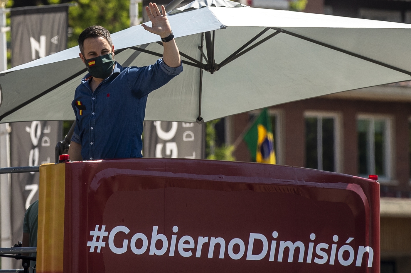 Leader of far right party Vox Santiago Abascal waves during a drive-in protest organised by Spain's far-right party Vox against the Spanish government's handling of the nation's coronavirus outbreak in Madrid, Spain Saturday, May 23, 2020. . (AP Photo/Manu Fernandez)