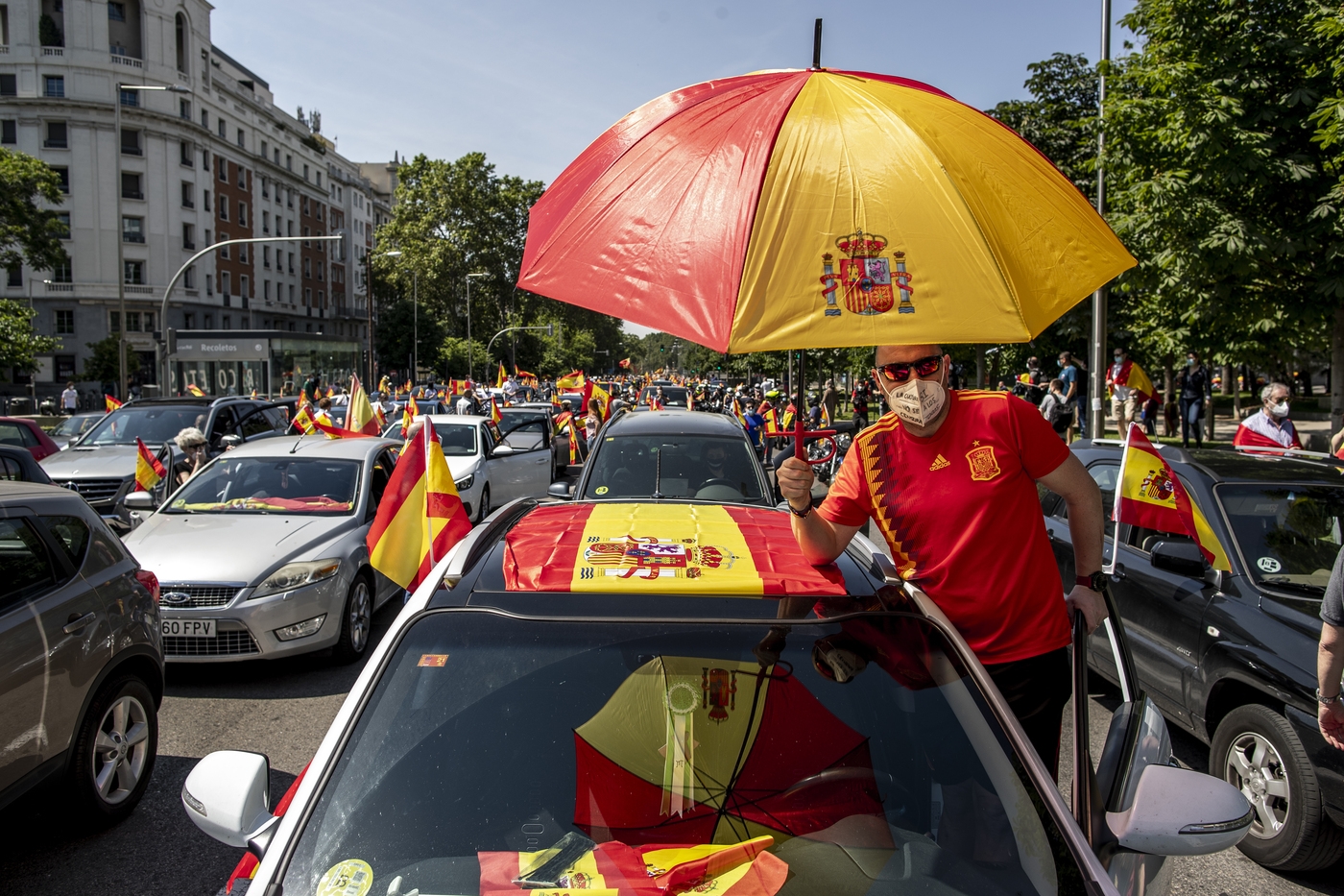 People wave Spanish flags during a drive-in protest organised by Spain's far-right Vox party against the Spanish government's handling of the nation's coronavirus outbreak in Madrid, Spain Saturday, May 23, 2020. (AP Photo/Manu Fernandez)