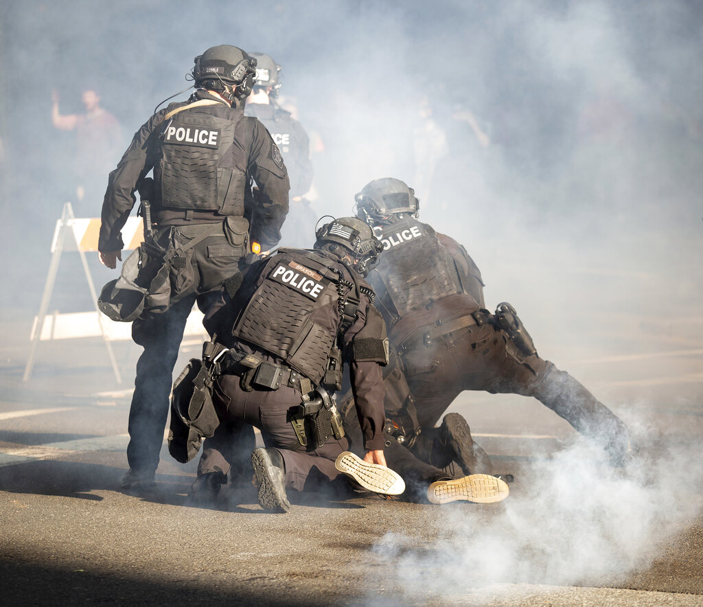 Police take down a protester in Spokane, Wash. on May 31, 2020, during a protest over the death of George Floyd on May 25.. (Libby Kamrowski/The Spokesman-Review via AP)