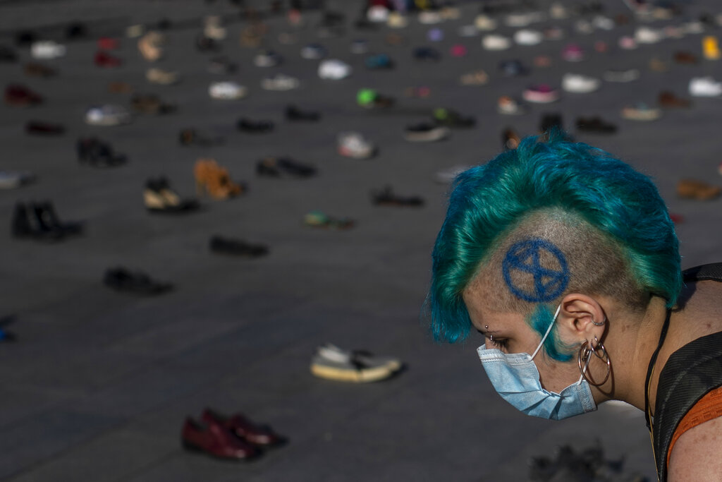 A member of the Extinction Rebellion group performs 