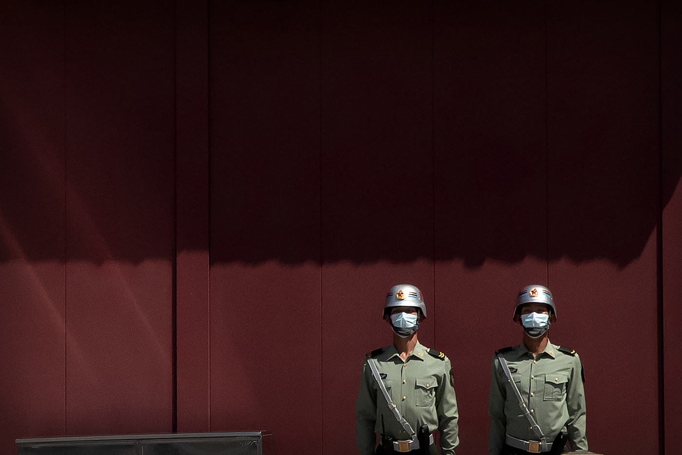 Paramilitary police wearing face masks to protect against the spread of the new coronavirus stand guard near Tiananmen Square in Beijing, Wednesday, May 20, 2020. China's rubber-stamp legislature is set to begin its annual session on Friday after being delayed several months amid the coronavirus outbreak. (AP Photo/Mark Schiefelbein)