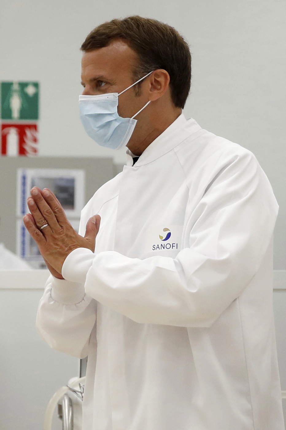 French President Emmanuel Macron visits an industrial development laboratory at the French drugmaker's vaccine unit Sanofi Pasteur plant in Marcy-l'Etoile, near Lyon, central France, Tuesday, June 16, 2020. The visit comes after rival pharmaceutical company AstraZeneca this weekend announced a deal to supply 400 million vaccine doses to EU countries, including France. (Gonzalo Fuentes/Pool via AP)