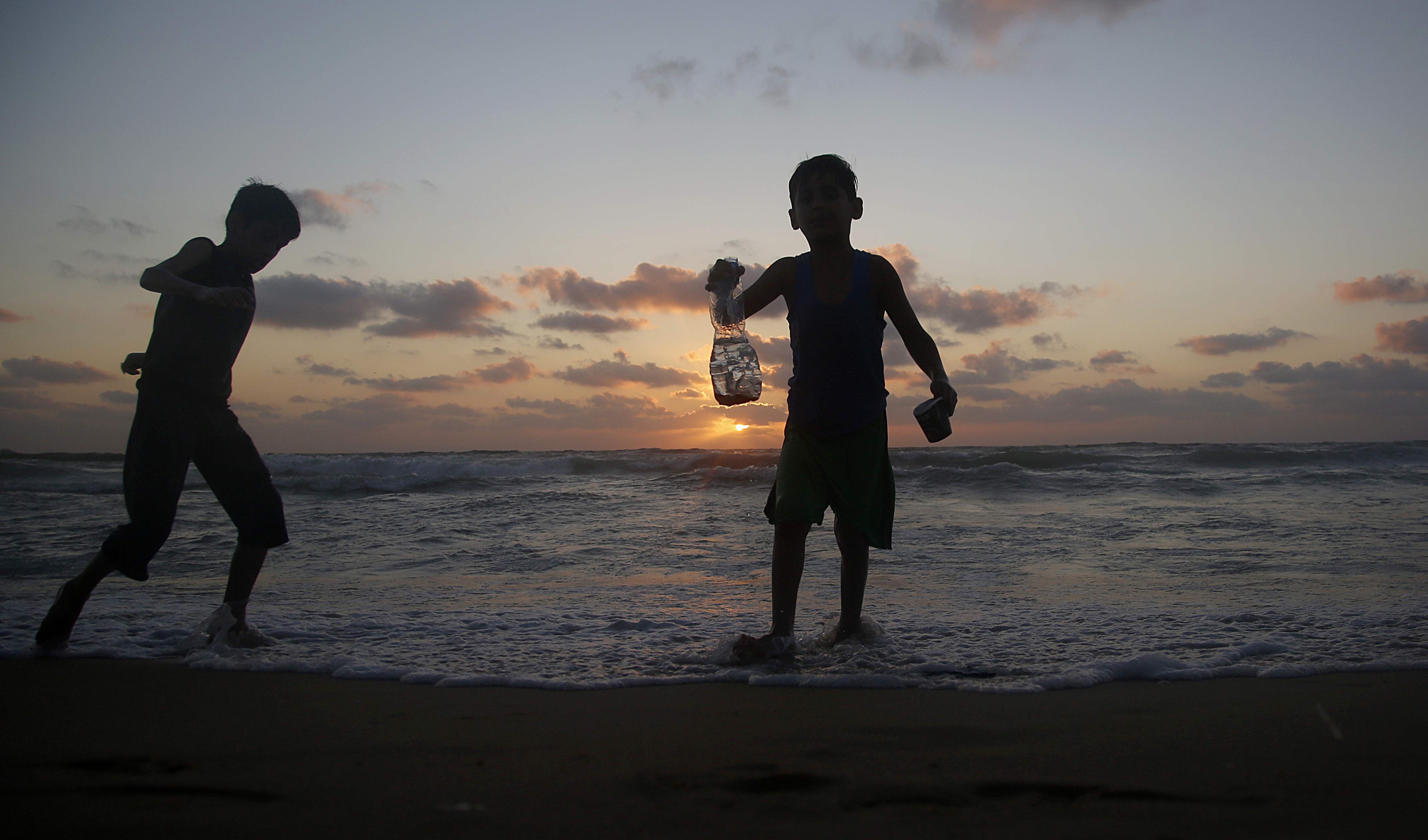 Palestinians enjoy the beach of the Mediterranean sea in Gaza City, Friday, June 19, 2020. The beach is one of the few open public spaces in this densely populated city. (AP Photo/Hatem Moussa)