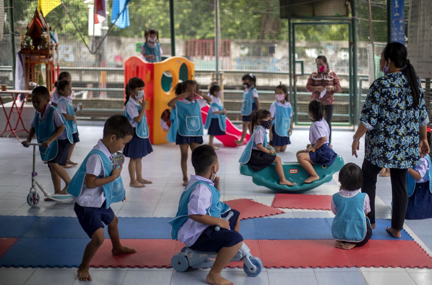 Children play at Makkasan preschool in Bangkok, Thailand, Wednesday, July 1, 2020. Thailand has begun a fifth phase of relaxations of COVID-19 restrictions, allowing the reopening of schools and high-risk entertainment venues such as pubs and massage parlors that had been shut since mid-March. (AP Photo/ Gemunu Amarasinghe)