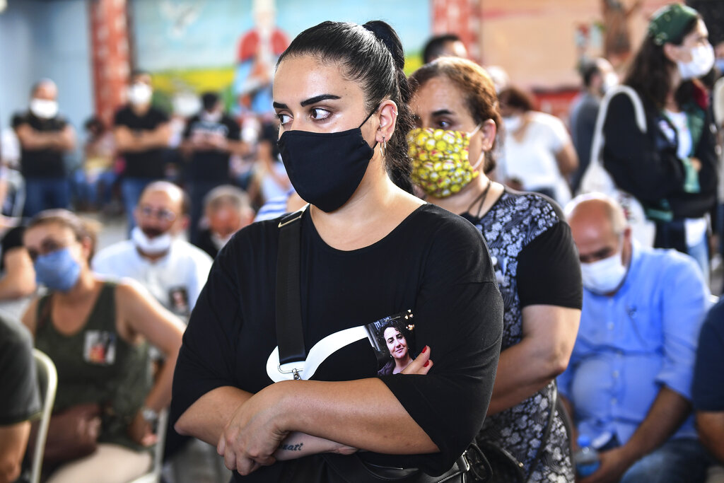 People attend the funeral of Ebru Timtik, a human rights lawyer who died during a hunger strike in a Turkish prison to demand a fair trial for herself and colleagues, in Istanbul, Friday, Aug. 28, 2020. Timtik, 42, died in an Istanbul hospital late Thursday, the Progressive Lawyers' Association said. She had been fasting for 238 days.(AP Photo)