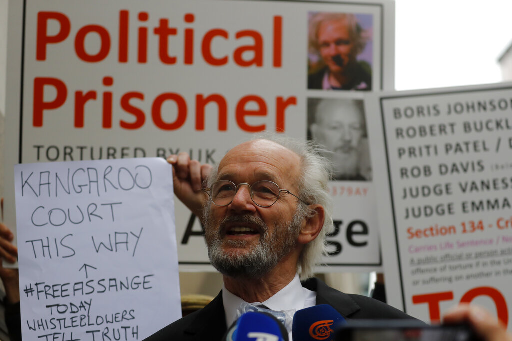 Julian Assange's father John Shipton during a protest to support Julian Assange at the Central Criminal Court Old Bailey in London, Monday, Sept. 7, 2020. Lawyers for WikiLeaks founder Julian Assange and the U.S. government were squaring off in a London court on Monday at a high-stakes extradition case delayed by the coronavirus pandemic. American prosecutors have indicted the 49-year-old Australian on 18 espionage and computer misuse charges over Wikileaks’ publication of secret U.S. military documents a decade ago. The charges carry a maximum sentence of 175 years in prison. (AP Photo/Frank Augstein)