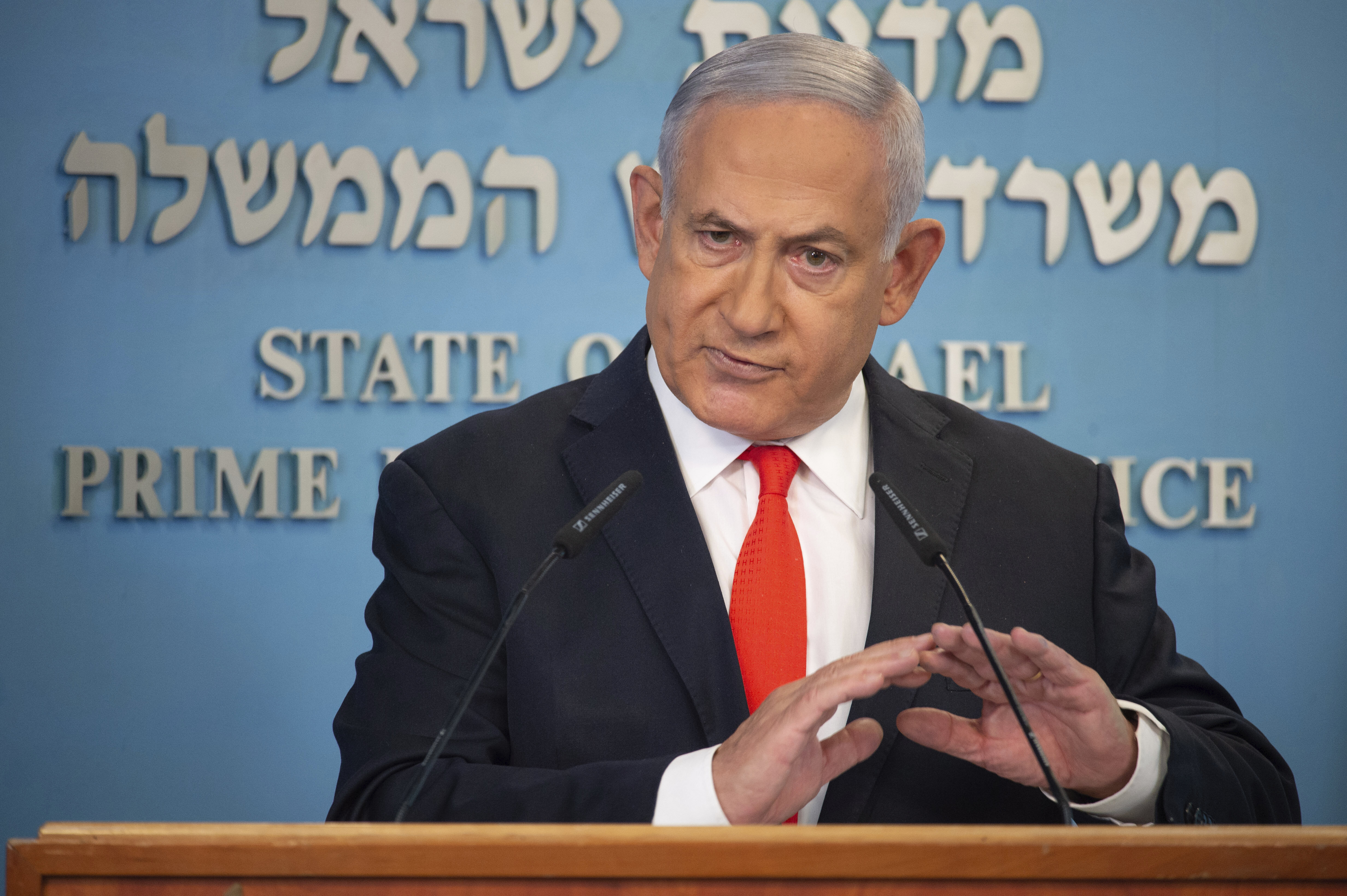 Israeli Prime Minister Benjamin Netanyahu speaks during a briefing on coronavirus development in Israel at his office in Jerusalem, Sunday, Sept. 13 2020. Netanyahu announced a new countrywide lockdown will be imposed amid a stubborn surge in coronavirus cases, with schools and parts of the economy expected to shut down in a bid to bring down infection rates. (Alex Kolomiensky/Yedioth Ahronoth/Pool via AP)