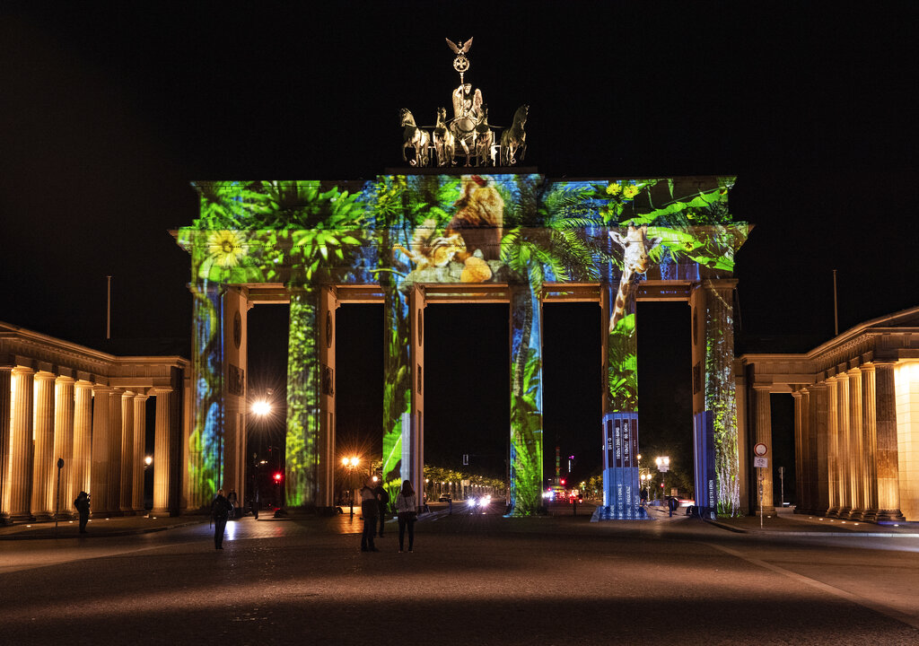 The Brandenburg Gate is illuminated during rehearsal on the eve of the 'Festival of Lights' in Berlin, Germany, Thursday, Sept. 10, 2020. Some of Berlin's most famous landmarks and buildings will be glowing and sparkling with various colours and types of light and projections during the festival, which runs from Friday Sept. 11 until Sunday, Sept. 20, 2020, at the German capital.Paul Zinken/dpa via AP)