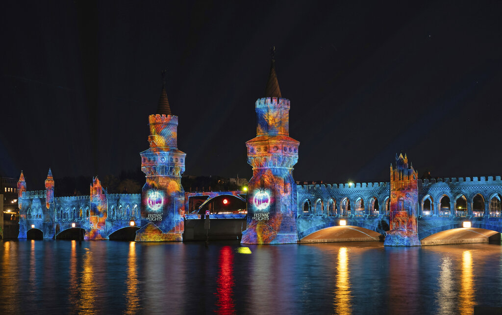 The Oberbaumbrücke is illuminated during the Festival of Lights, Friday, Sept. 18, 2020, in Berlin, Germany. (Paul Zinken/dpa via AP)