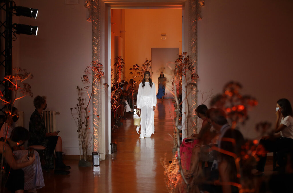 A model shows a creation by Caterina Moro part of the 2021 spring-summer collection during the Altaroma fashion show in Rome, Thursday, Sep. 17, 2020. The COVID-19 pandemic has forced many fashion brands to rethink the way they will show their collections. The upcoming Milan Fashion Week, from Sept. 22 through Sept. 28, has a lineup of 52 shows 24 of which will be in a digital form. (AP Photo/Alessandra Tarantino)