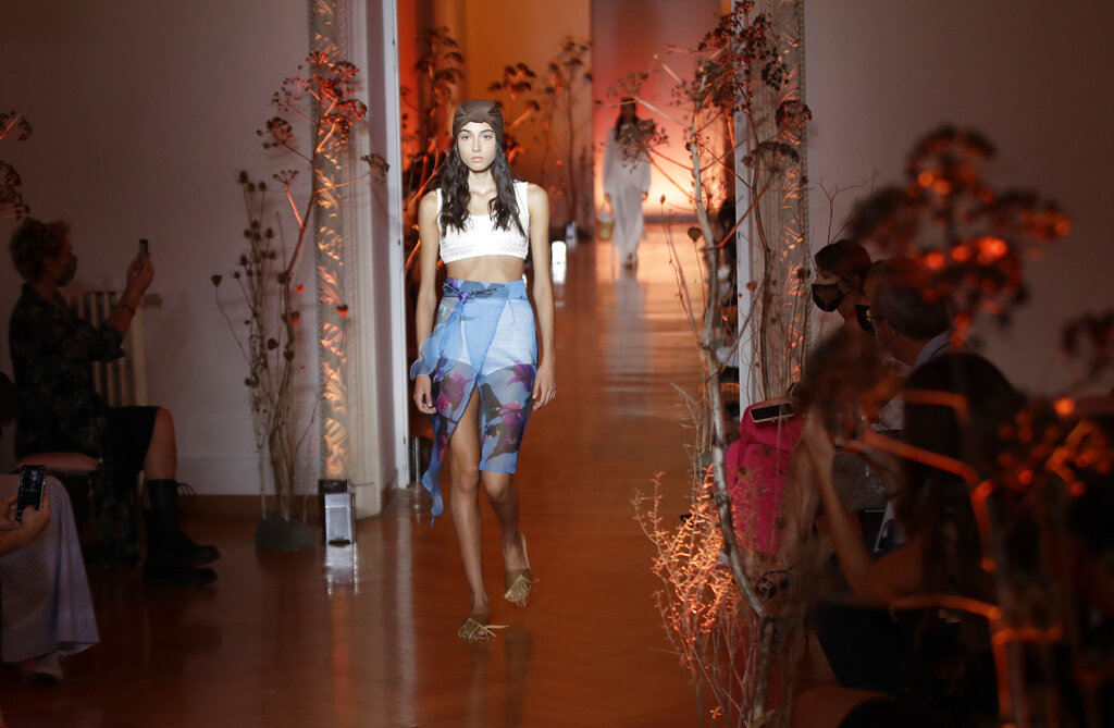 A model shows a creation by Caterina Moro part of the 2021 spring-summer collection during the Altaroma fashion show in Rome, Thursday, Sep. 17, 2020. The COVID-19 pandemic has forced many fashion brands to rethink the way they will show their collections. The upcoming Milan Fashion Week, from Sept. 22 through Sept. 28, has a lineup of 52 shows 24 of which will be in a digital form. (AP Photo/Alessandra Tarantino)