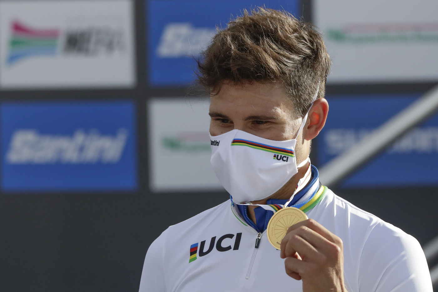 Italy's Filippo Ganna shows his gold medal of the men's Individual Time Trial event, at the road cycling World Championships, in Imola, Italy, Friday, Sept. 25, 2020. (AP Photo/Andrew Medichini)