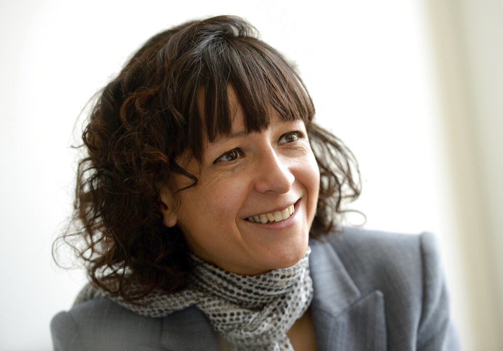 FILE -- In this May 19, 2015 file photo French microbiologist Emmanuelle Charpentier poses for a photo in Brunswick, Germany. French scientist Emmanuelle Charpentier and American Jennifer A. Doudna have won the Nobel Prize 2020 in chemistry for developing a method of genome editing likened to ‘molecular scissors’ that offer the promise of one day curing genetic diseases. (Peter Steffen/dpa via AP)