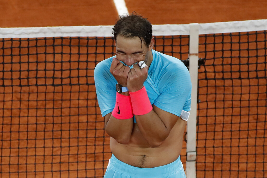 Spain's Rafael Nadal celebrates winning the final match of the French Open tennis tournament against Serbia's Novak Djokovic in three sets, 6-0, 6-2, 7-5, at the Roland Garros stadium in Paris, France, Sunday, Oct. 11, 2020. (AP Photo/Alessandra Tarantino)