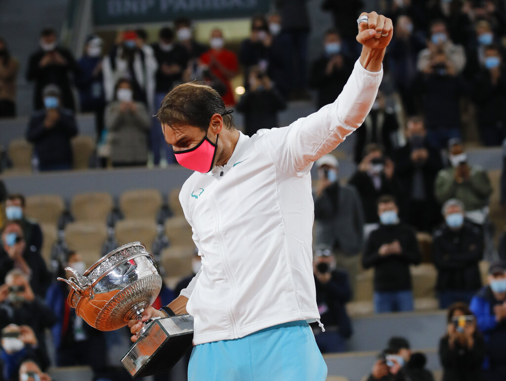 Spain's Rafael Nadal celebrates winning the final match of the French Open tennis tournament against Serbia's Novak Djokovic in three sets, 6-0, 6-2, 7-5, at the Roland Garros stadium in Paris, France, Sunday, Oct. 11, 2020. (AP Photo/Christophe Ena)