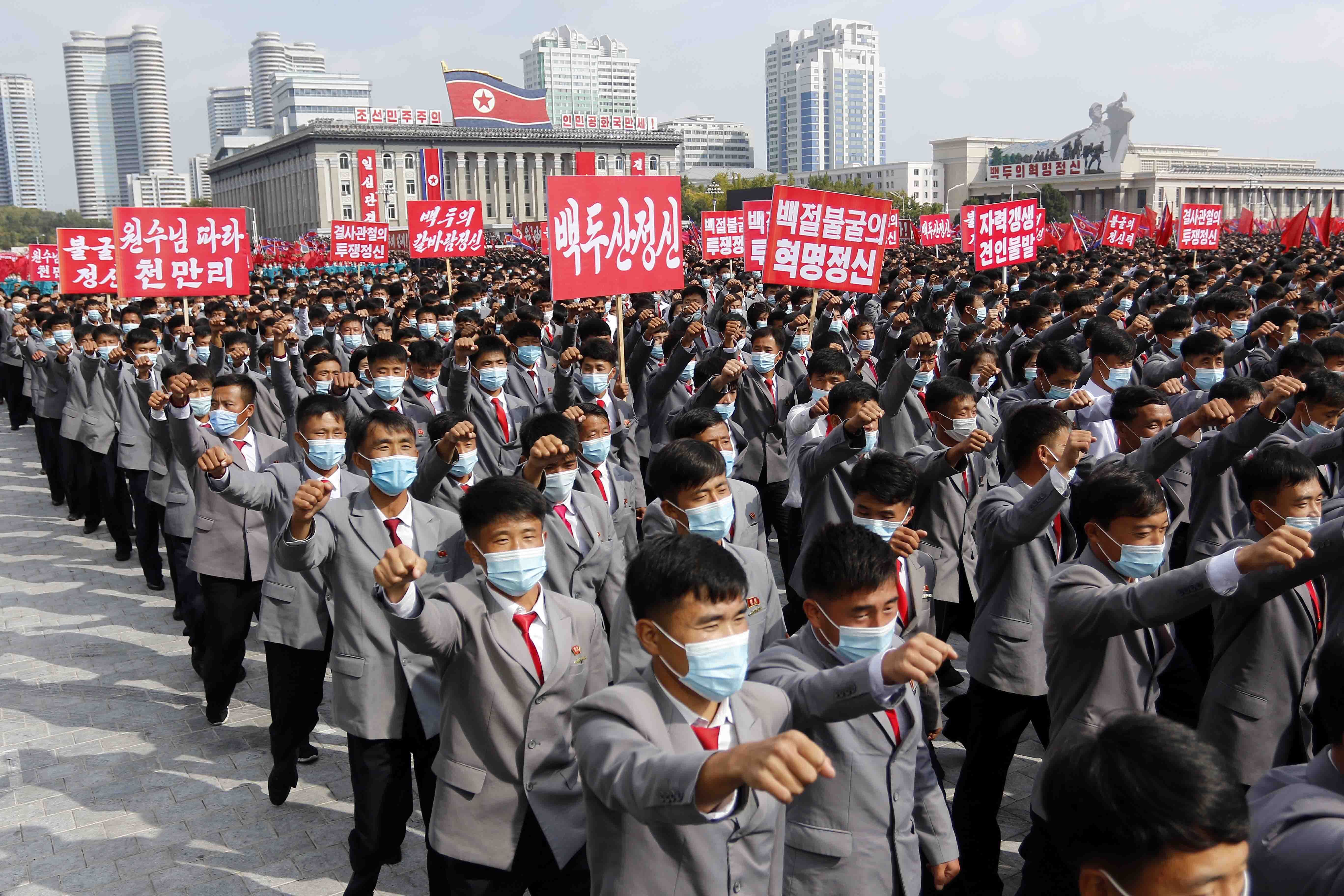 Thousands rally to welcome the 8th Congress of the Workers' Party of Korea in the Party at Kim Il Sung Square in Pyongyang, North Korea, Monday, Oct. 12, 2020. (AP Photo/Jon Chol Jin)