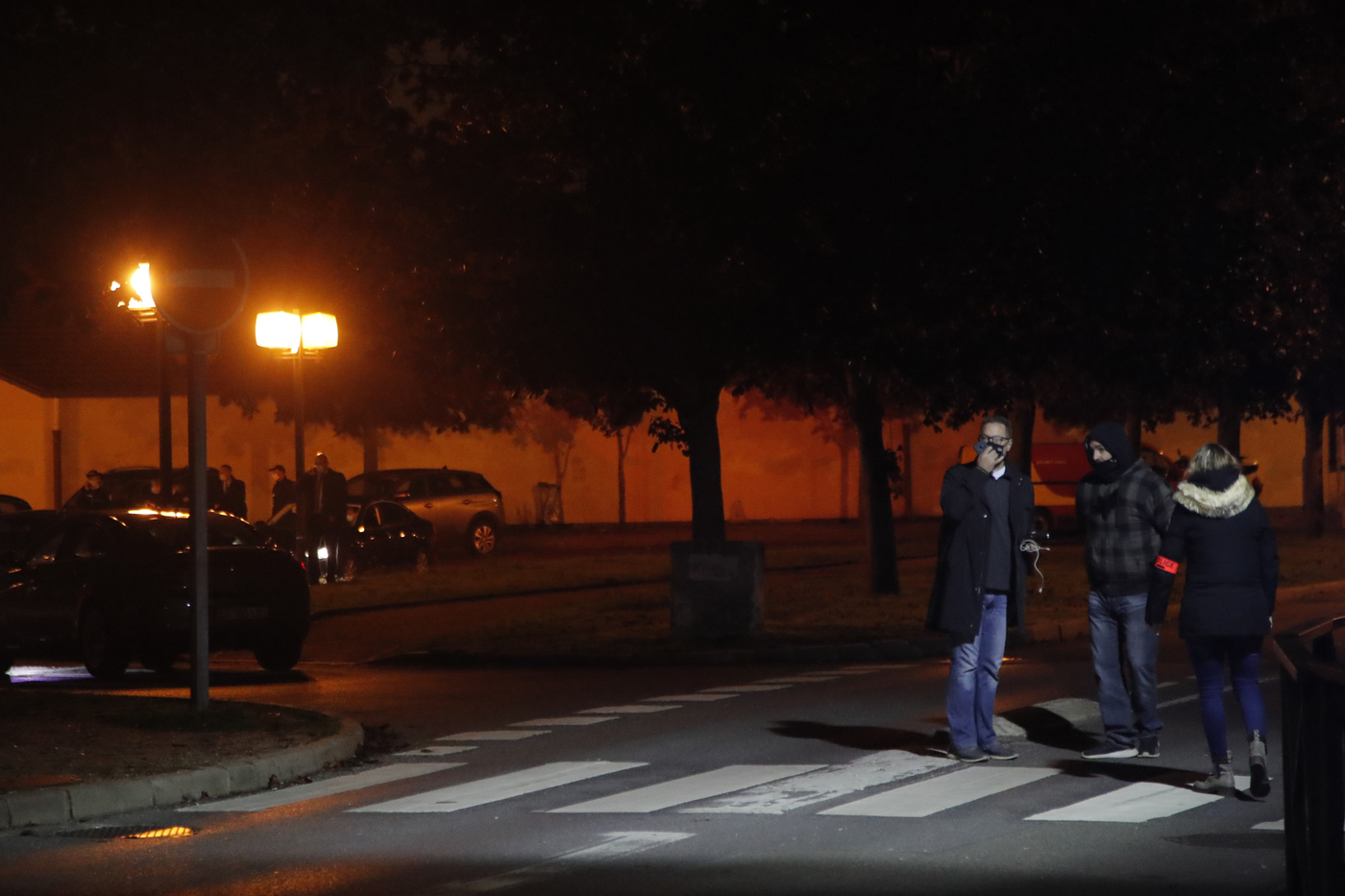 French police officers gather after a history teacher who opened a discussion with students on caricatures of Islam's Prophet Muhammad was decapitated in a French street on Friday and police have shot the suspected killer dead, Friday, Oct. 16, 2020 in Conflans-Saint-Honorine, north of Paris. (AP Photo/Michel Euler)