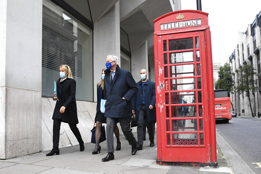 EU Chief Negotiator Michel Barnier wears an EU themed face mask as he makes his way to the Westminster Conference Centre in London, Saturday, Oct. 24, 2020. (AP Photo/Alberto Pezzali)