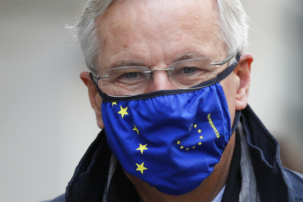 EU Chief Negotiator Michel Barnier walks to a meeting in London, Wednesday, Oct. 28, 2020. Barnier is in London to resume talks over post Brexit trade agreements. (AP Photo/Kirsty Wigglesworth)