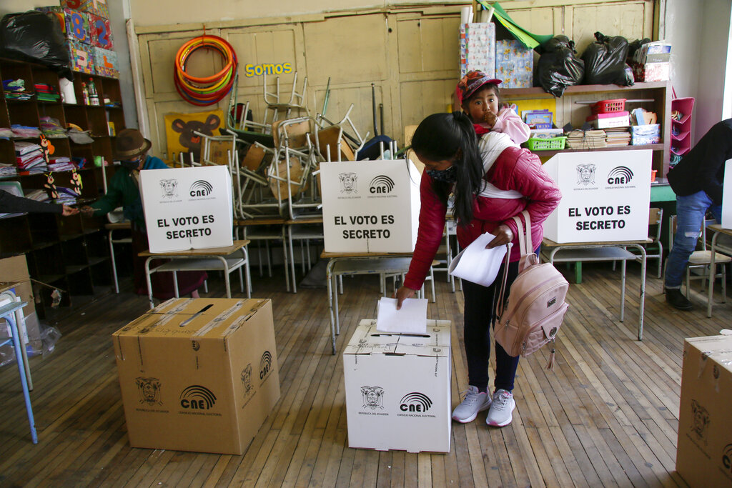 A woman votes in Cangahua, Ecuador, Sunday, Feb. 7, 2021. Amidst the new coronavirus pandemic Ecuadoreans went to the polls in a first round presidential and legislative election. (AP Photo/Dolores Ochoa)