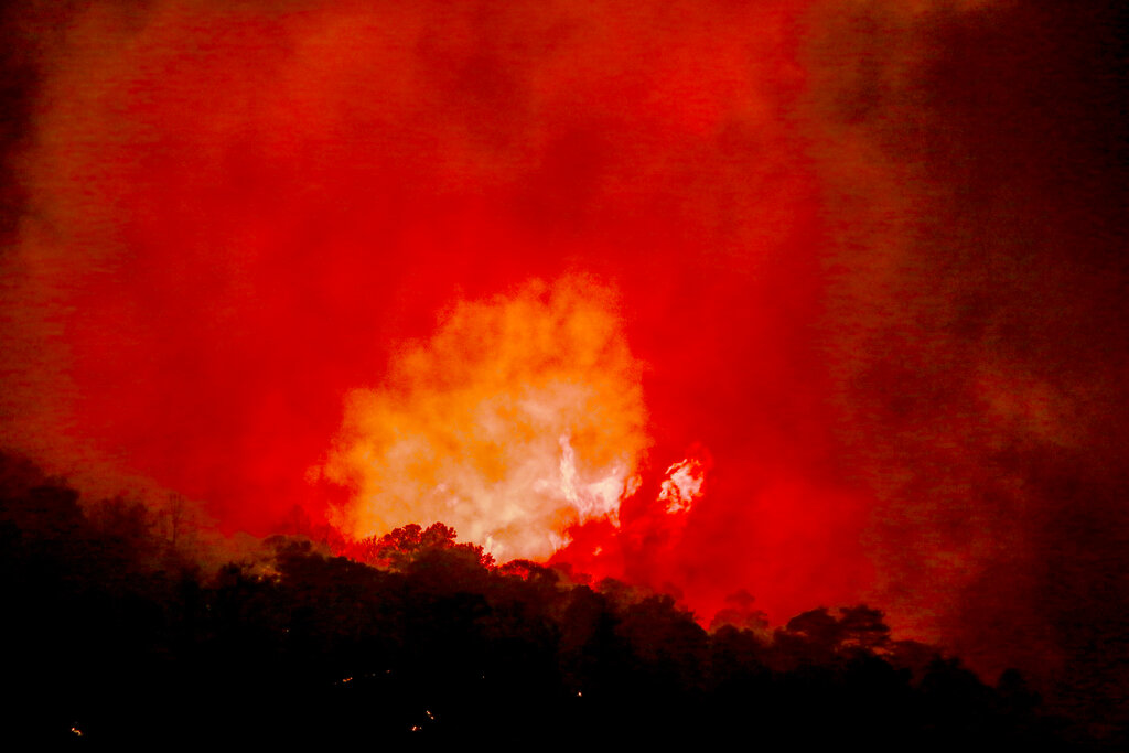 The Sheep fire burns in Wrightwood, Calif., Monday, June 13, 2022. (AP Photo/Ringo H.W. Chiu)