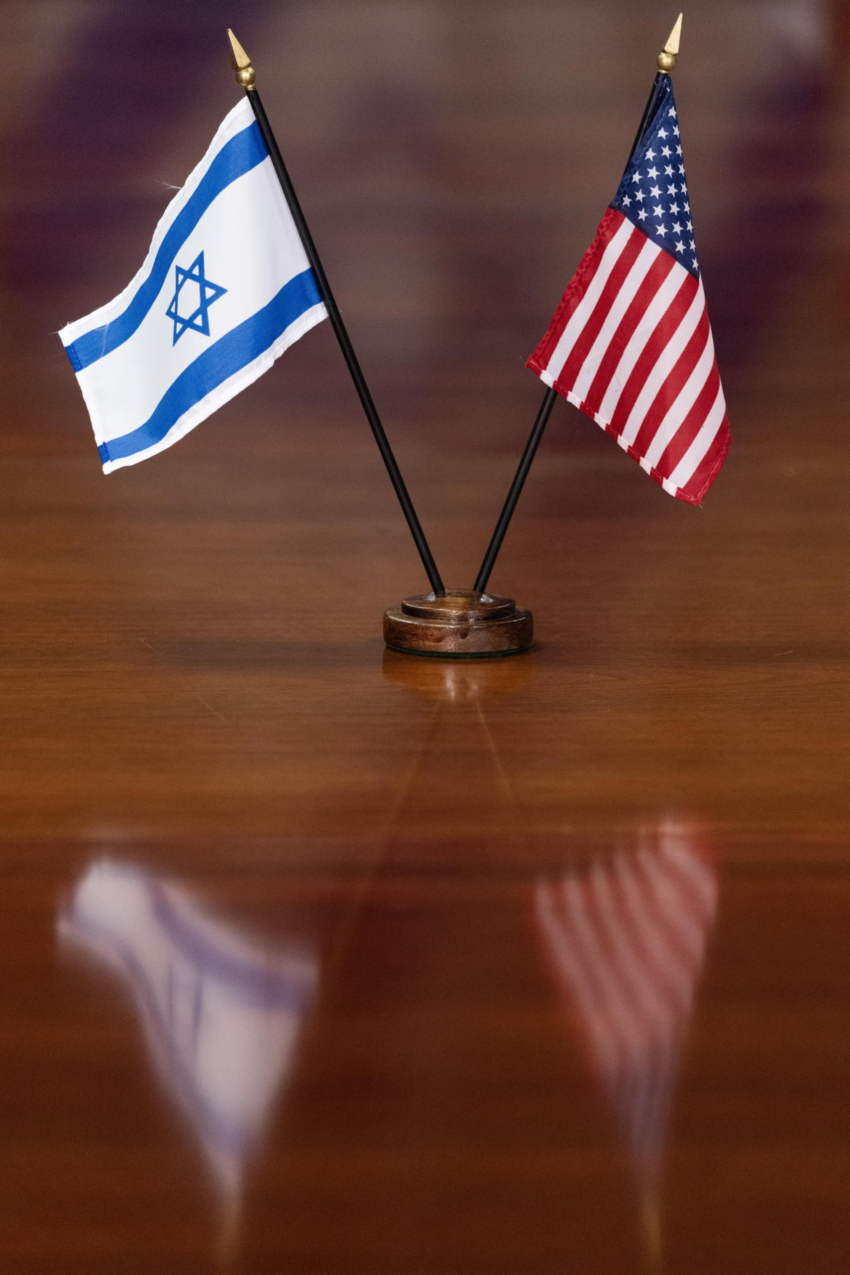 epa11244711 The national flags of Israel and the United States are placed on a table during a meeting between Israeli Defense Minister Yoav Gallant and US Secretary of Defense Lloyd Austin at the Pentagon in Arlington, Virginia, USA, 26 March 2024. Gallant's visit to the US capital comes amid high tensions between the US administration and Israel. Israeli President Netanyahu cancelled an Israeli delegation's visit to Washington in response to the US abstaining from a United Nations Security Council vote on a ceasefire in Gaza proposal.  EPA/MICHAEL REYNOLDS