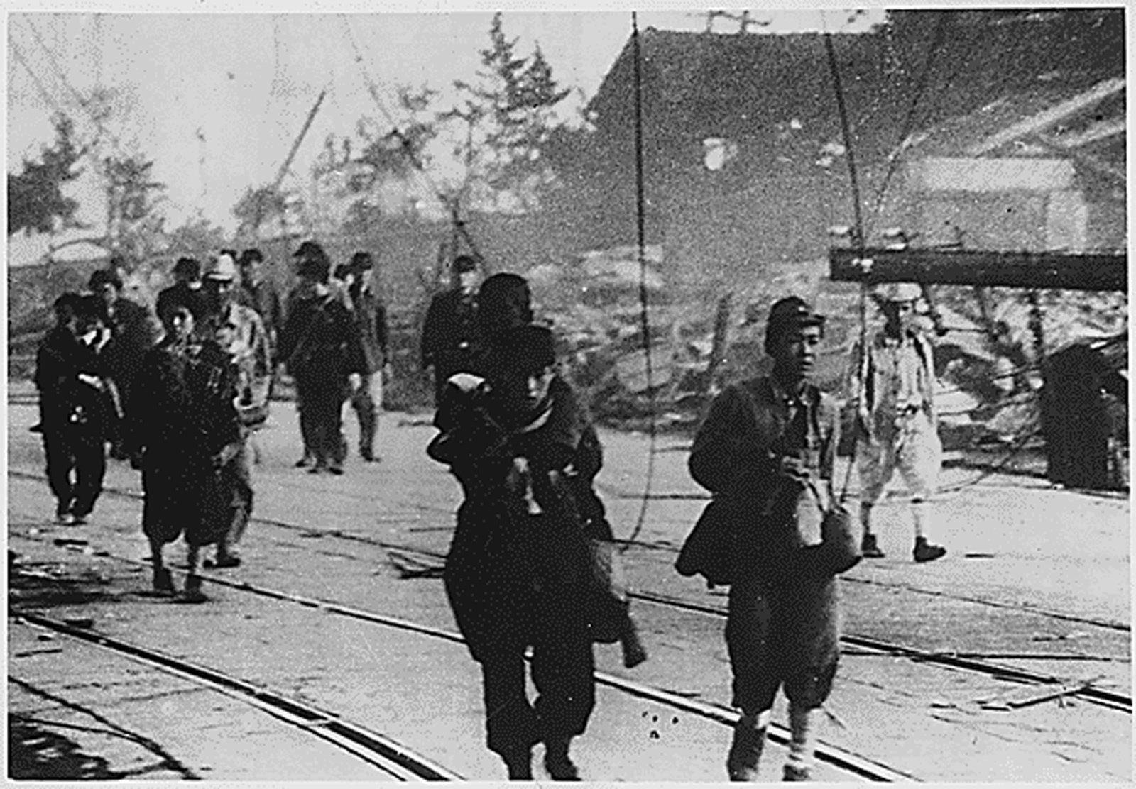 epa04867686 An undated handout image made available by the US National Archives and Records Administration (NARA) of survivors moving along the road after the atomic bombing of Nagasaki, Japan, in August 1945. 06 August 2015 marks the 70th anniversary of the atomic bombing on Hiroshima. The US B-29 Superfortress bomber Enola Gay dropped an atomic bomb codenamed 'Little Boy' on Hiroshima on 06 August 1945, killing tens of thousands of people in seconds. By the end of the year, 140,000 people had died from the effects of the bomb. On 09 August 1945 a second atomic bomb was exploded over Nagasaki, killing more than 73,000 people. The 'Little Boy' was the first ever nuclear bomb dropped on a city and a crucial turn that led to Japan's surrender in WWII.  EPA/US NATIONAL ARCHIVES / HANDOUT  HANDOUT EDITORIAL USE ONLY