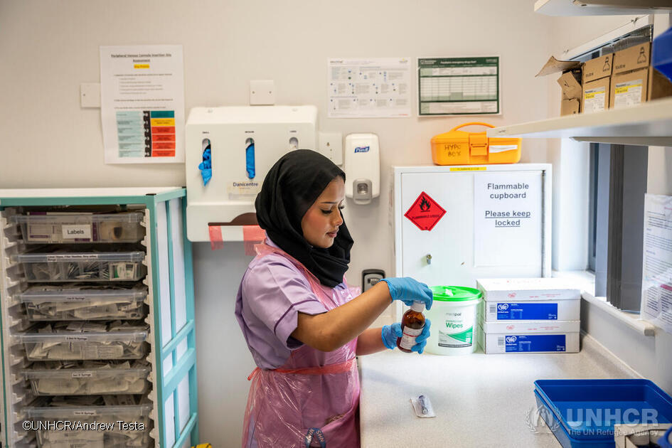 Kismat Ara at work in the Children’s Ward at Bradford Royal Infirmary. ; Kismat Ara, 21, is a Rohingya refugee who was resettled to the city of Bradford with her family in 2009 from Cox’s Bazar, Bangladesh. She graduated in 2023 from the University of Bradford with a degree in Child Nursing and has just begun working as a Staff Nurse at Bradford Royal Infirmary’s Children’s Ward, encouraged by the welcoming environment and supported by her fellow nurses and colleagues.