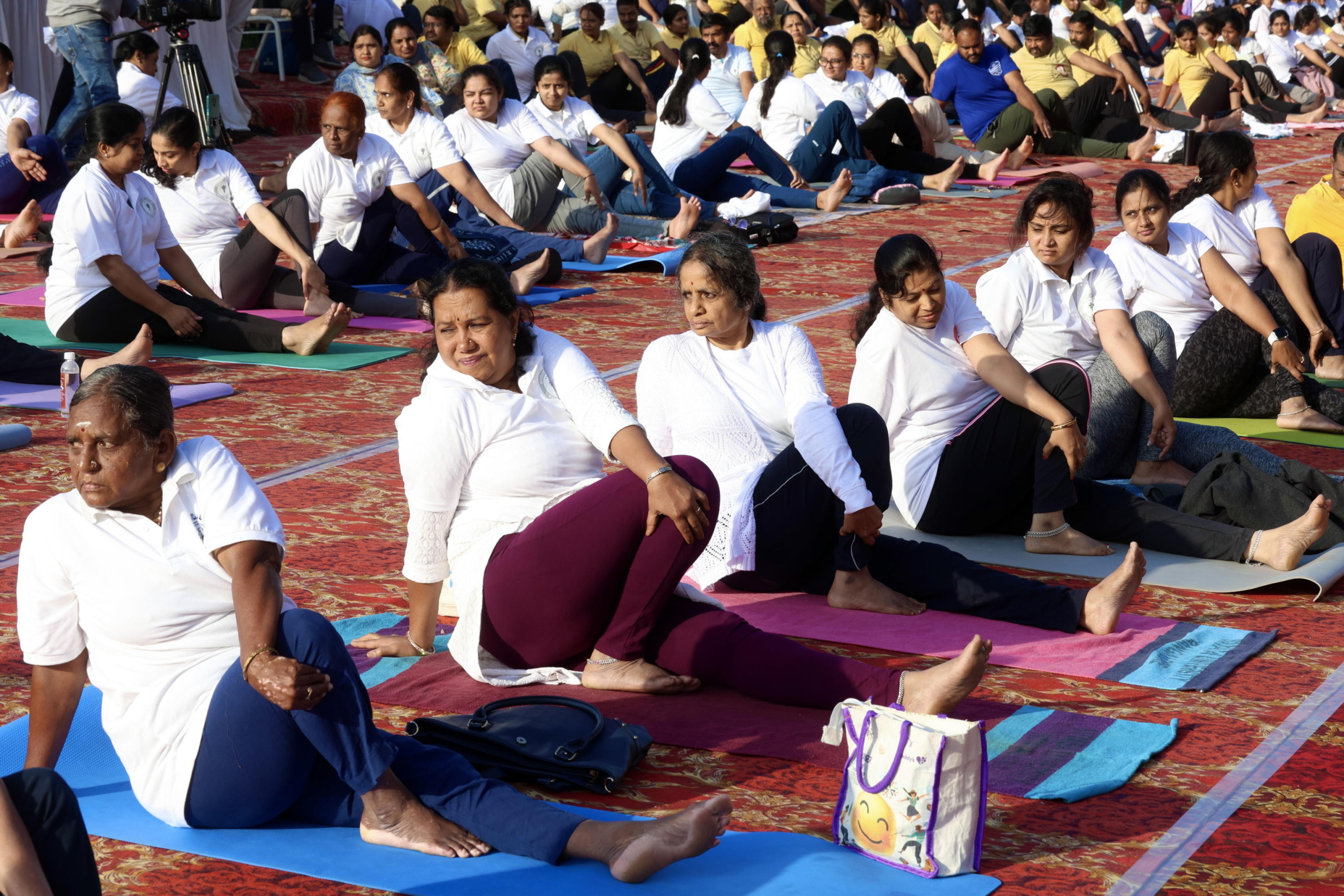 epa11427212 Yoga enthusiasts attend a themed exercise entitled 'focusing on enhancing the physical and mental well-being of women' on the 10th International Day of Yoga, in Bangalore, India, 21 June 2024. International Yoga Day is celebrated annually on 21 June and has been recognized worldwide since 2015. The United Nations declared yoga a practice of physical, mental, and spiritual exercise originating in ancient India.  EPA/JAGADEESH NV