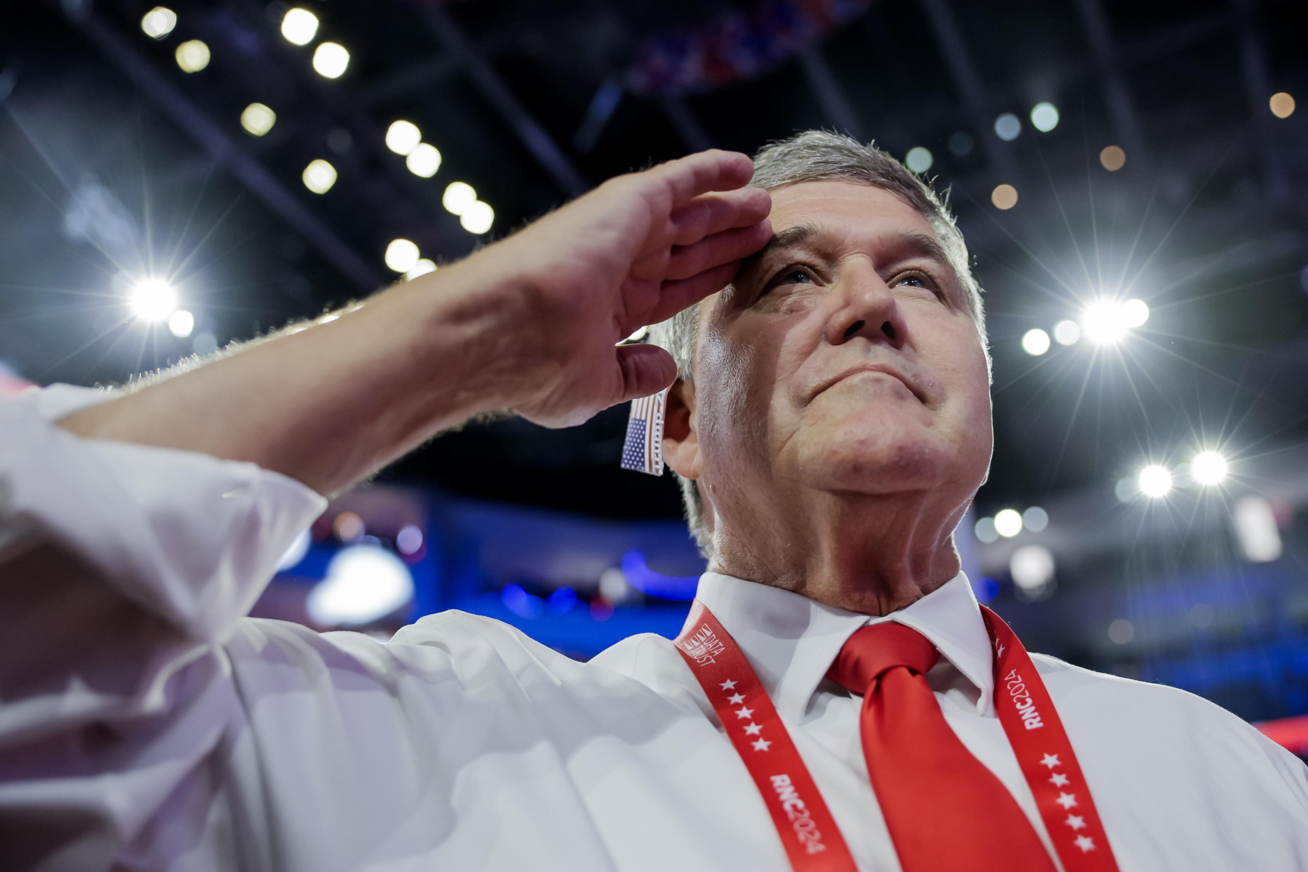 epa11486417 A delegate salutes during the US national anthem on the fourth day of the Republican National Convention (RNC) at Fiserv Forum in Milwaukee, Wisconsin, USA, 18 July 2024. The convention comes days after a 20-year-old Pennsylvania man attempted to assassinate former president and current Republican presidential nominee Donald Trump. The 2024 Republican National Convention is being held 15 to 18 July 2024 in which delegates of the United States' Republican Party select the party's nominees for president and vice president in the 2024 United States presidential election.  EPA/ALLISON DINNER