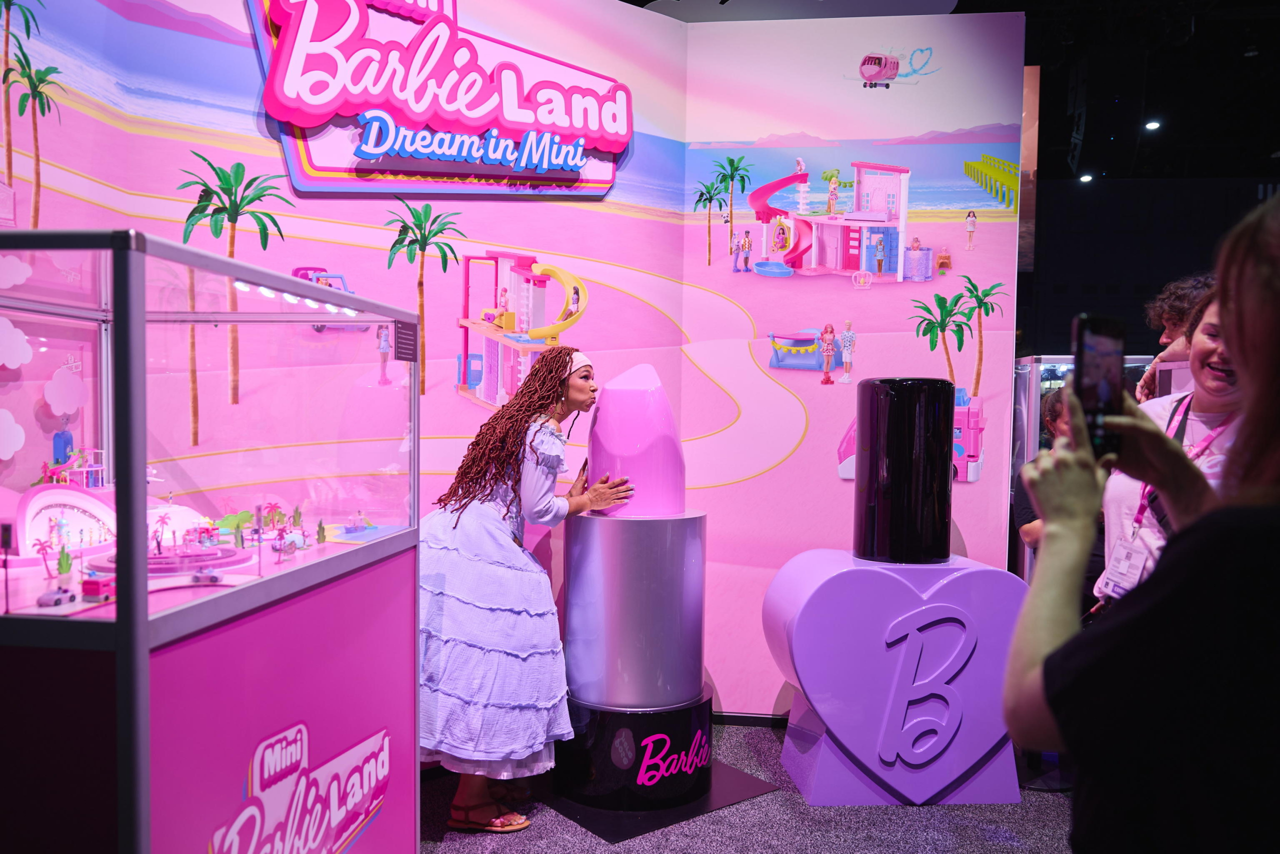 epa11496725 A person interacts with a Barbie scene at Comic-Con International in San Diego, California, USA, 25 July 2024. San Diego Comic-Con International is a comics arts conference held from 25-28 July 2024.  EPA/ALLISON DINNER