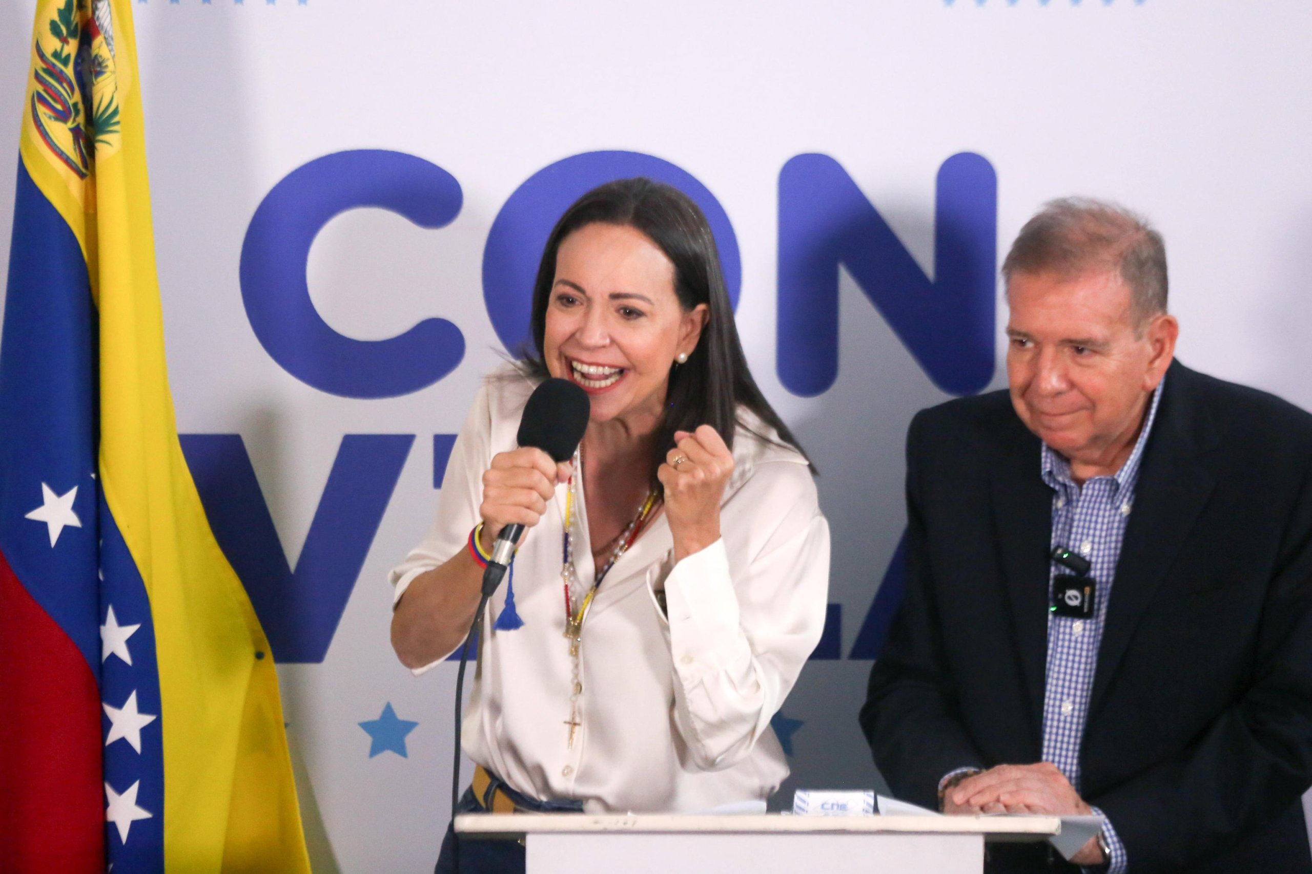 epa11507672 Opposition leader Maria Corina Machado (L) speaks during a press conference with the Presidential candidate to the Venezuelan elections Edmundo Gonzalez Urrutia (R) in Caracas, Venezuela, 29 July 2024. Machado said that the opposition obtained 73 % of the vote tallies, saying they can prove they won the presidential elections that took place on 28 July. The Venezuelan National Electoral Council (CNE) has proclaimed that Nicolas Maduro was re-elected president of Venezuela.  EPA/Manuel Diaz