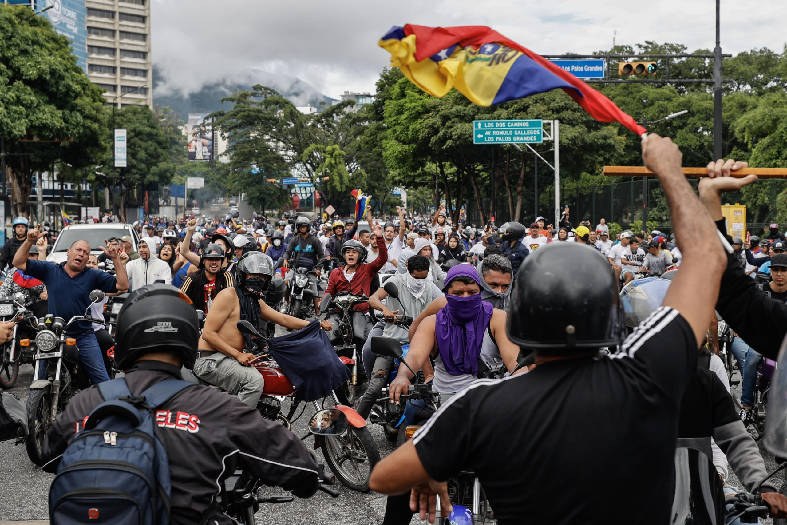 epa11507581 People ride through the streets on motorcycles during a protest against the results of the presidential elections, in Caracas, Venezuela, 29 July 2024. According to the first report from the National Electoral Council (CNE), Maduro was re-elected for a third consecutive term in the elections held on 28 July, in which he obtained 51.2 percent of the votes (5,150,092 votes), while the standard-bearer of the majority opposition, Edmundo Gonzalez Urrutia, obtained 4,445,978 votes, which represents 44.2 percent of the votes. The opposition is calling for the release of the full vote count.  EPA/Henry Chirinos