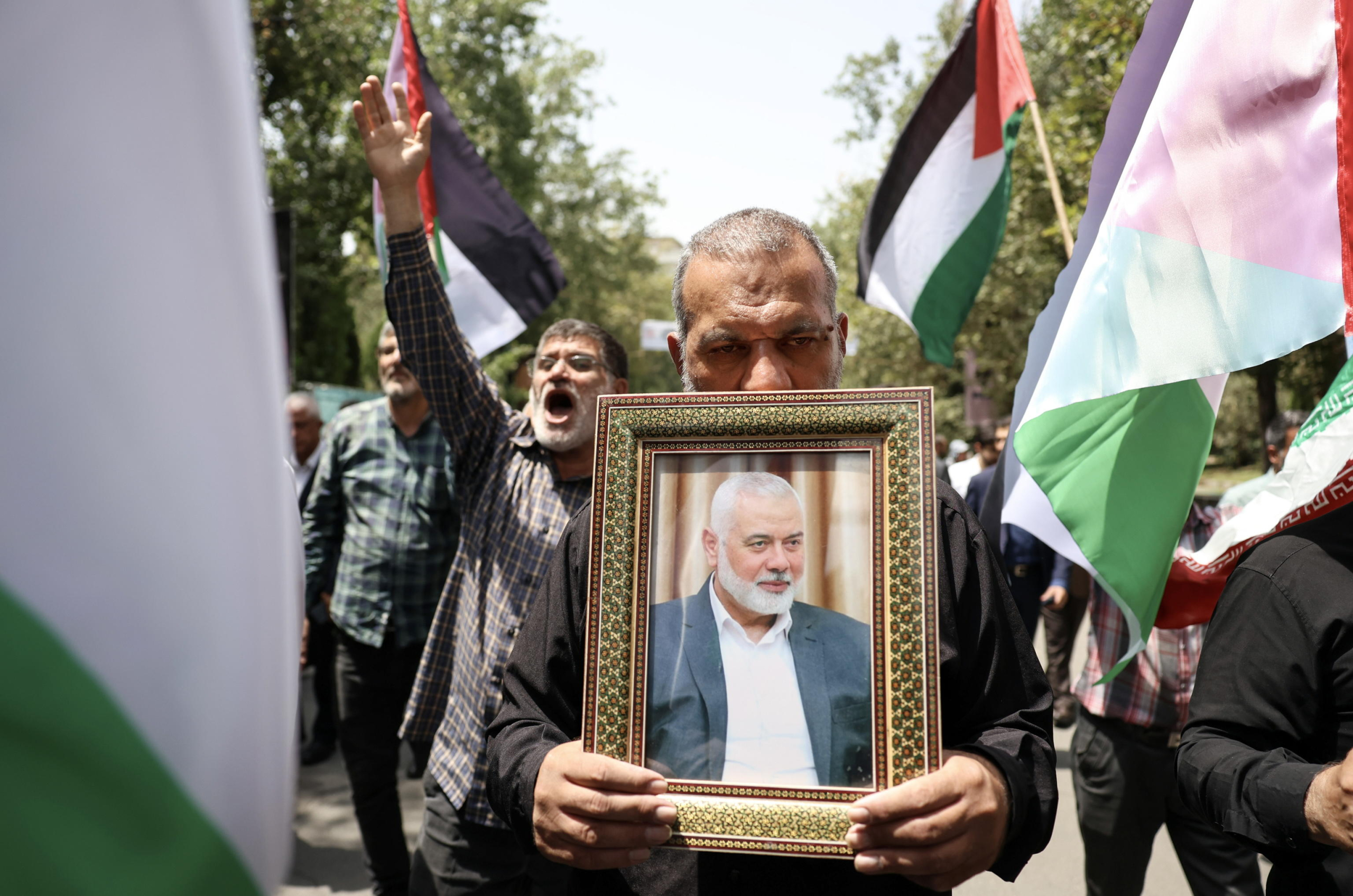 Proteste in Iran per l'uccisione del leader di Hamas Ismail Haniyeh. Foto Ansa EPA/ABEDIN TAHERKENAREH