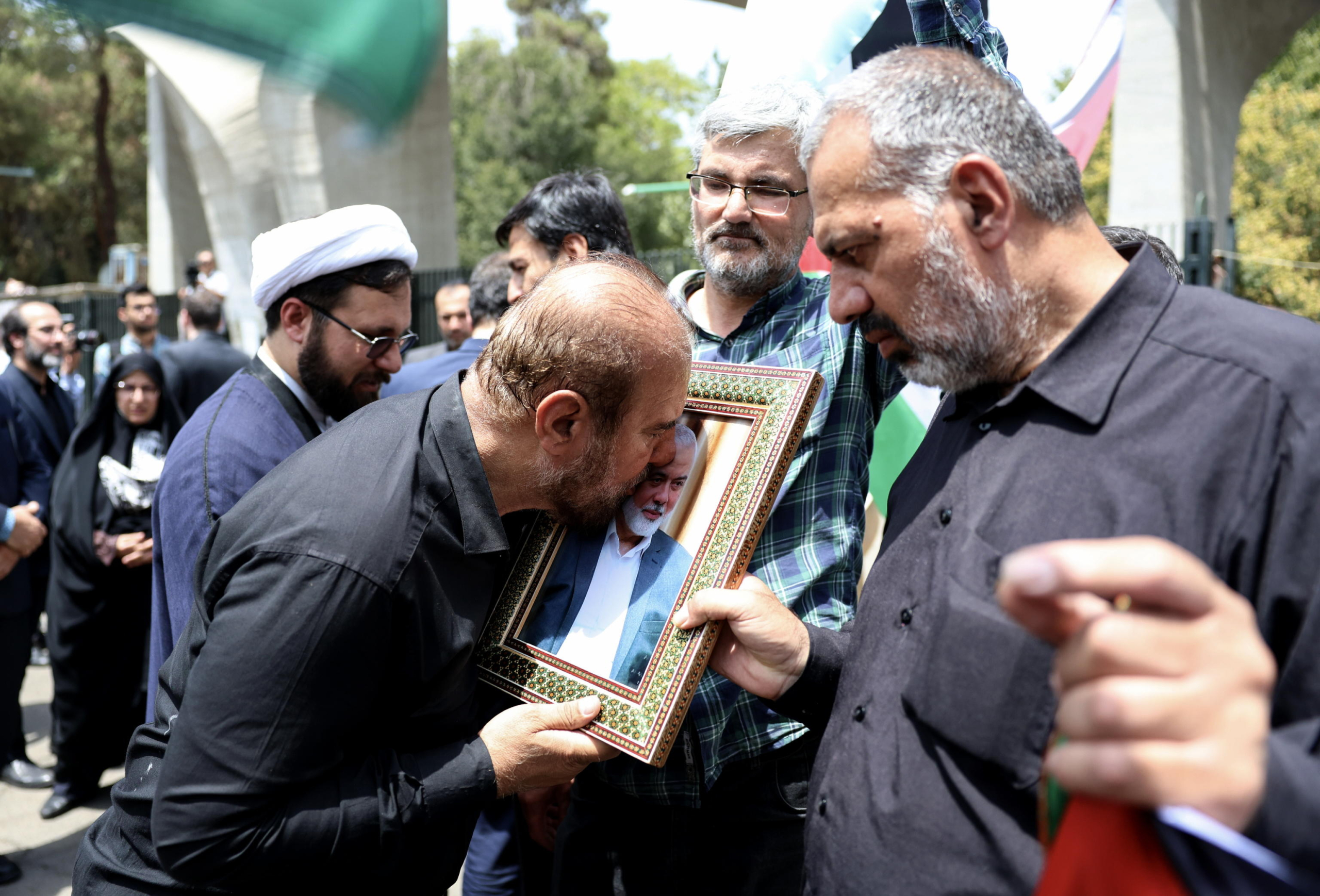Proteste in Iran per l'uccisione del leader di Hamas Ismail Haniyeh. Foto Ansa EPA/ABEDIN TAHERKENAREH