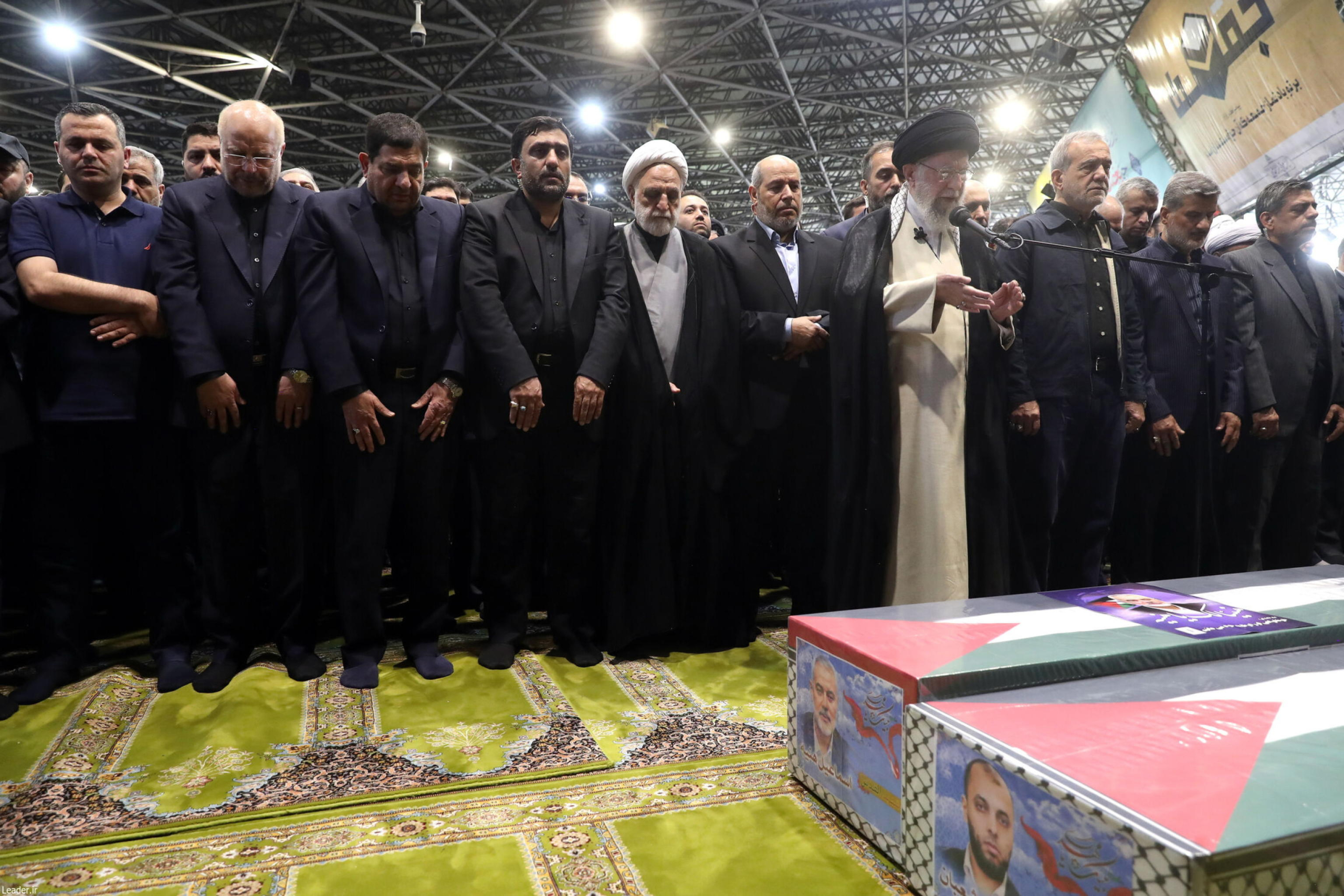 epa11514629 A handout photo made available by the Iranian Supreme Leader's Office shows Supreme Leader Ayatollah Ali Khamenei (front) leading a prayer before the coffins of late Hamas leader Ismail Haniyeh and his bodyguard in Tehran, Iran, 01 August 2024. Haniyeh and one of his bodyguards were targeted and killed in Tehran on 31 July 2024, the Iranian Revolutionary Guard Corps (IRGC) confirmed.  EPA/IRANIAN SUPREME LEADER OFFICE HANDOUT HANDOUT EDITORIAL USE ONLY/NO SALES