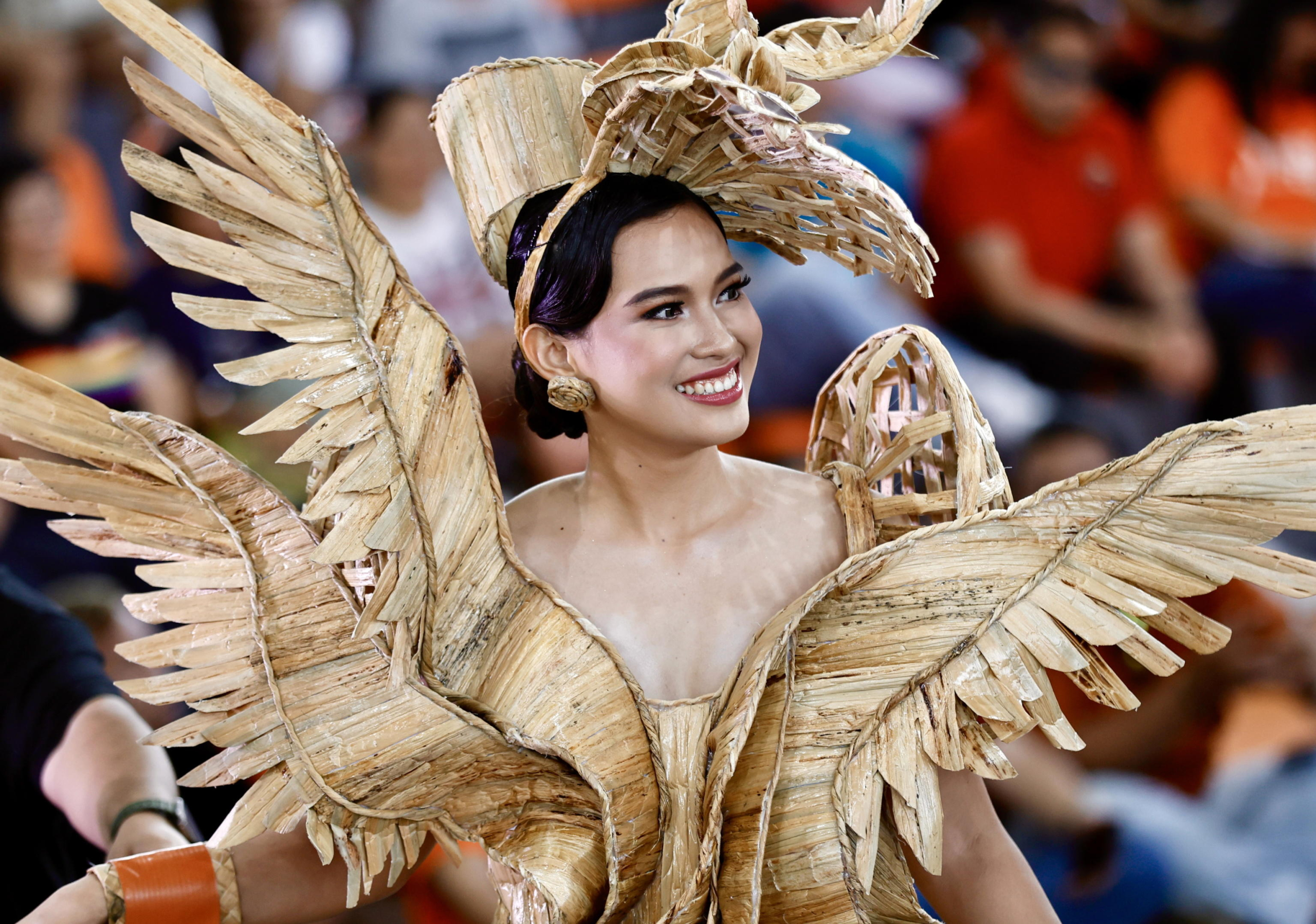 epa11529281 Irish Silades wears a gown made from dried water hyacinth stalks as she parades during the Water Lily Festival in Las Pinas city, Metro Manila, Philippines, 06 August 2024. The annual Water Lily Festival in Las Pinas city was declared by the Villar Foundation to highlight the transformation of water lilies from aquatic nuisances to valuable resources. Through the 'Water Lily Weaving Project', the foundation turns these plants into handicrafts, creating livelihoods and aiding community rehabilitation. During the festival, villagers parade in traditional costumes made from dried water lilies, showcasing the project's success and promoting the benefits of water lily-based livelihoods for local residents.  EPA/FRANCIS R. MALASIG