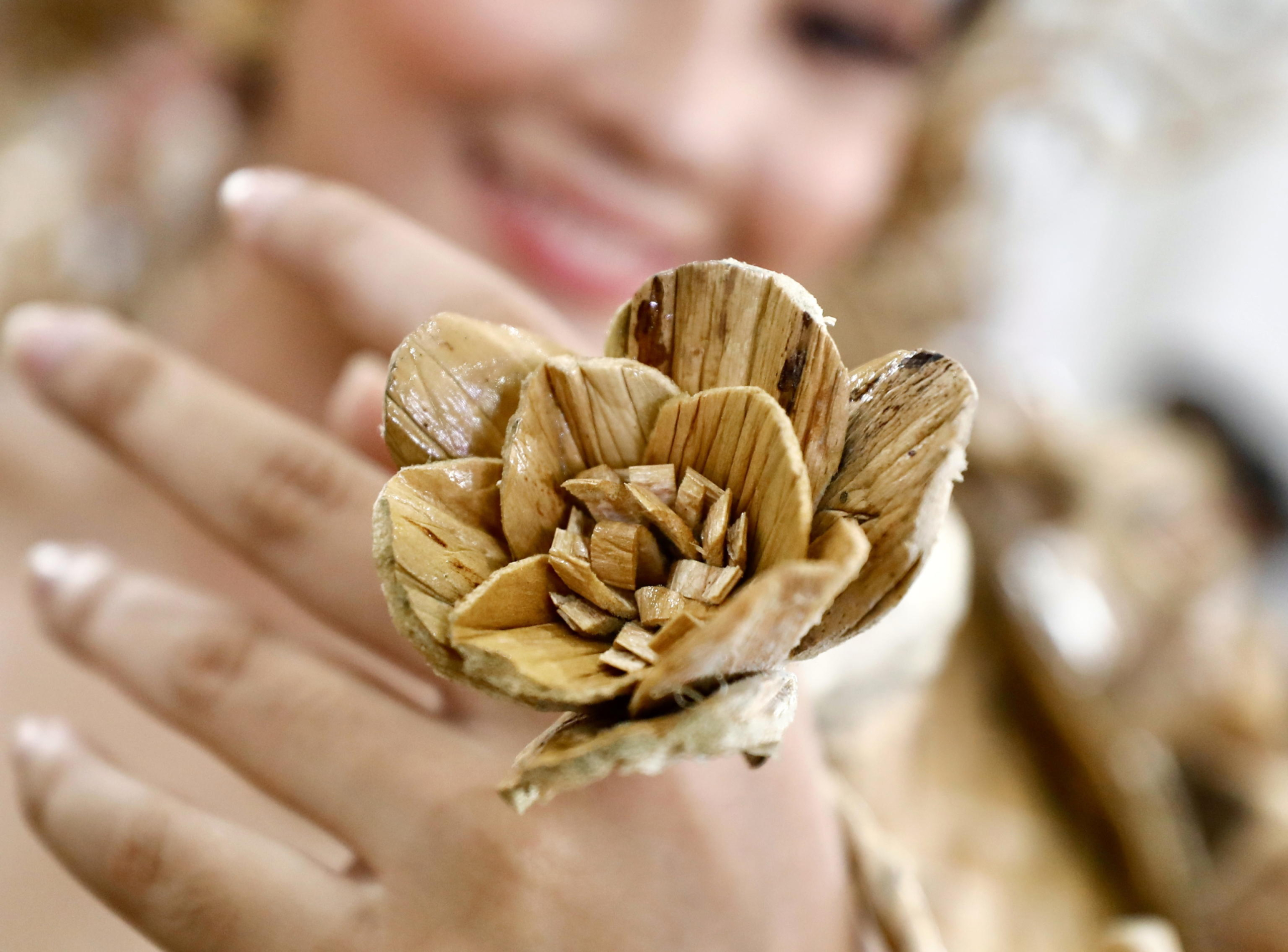 epa11529272 A Filipino woman wearing a ring, made from dried water hyacinth stalks, poses during the Water Lily Festival in Las Pinas city, Metro Manila, Philippines, 06 August 2024. The annual Water Lily Festival in Las Pinas city was declared by the Villar Foundation to highlight the transformation of water lilies from aquatic nuisances to valuable resources. Through the 'Water Lily Weaving Project', the foundation turns these plants into handicrafts, creating livelihoods and aiding community rehabilitation. During the festival, villagers parade in traditional costumes made from dried water lilies, showcasing the project's success and promoting the benefits of water lily-based livelihoods for local residents.  EPA/FRANCIS R. MALASIG