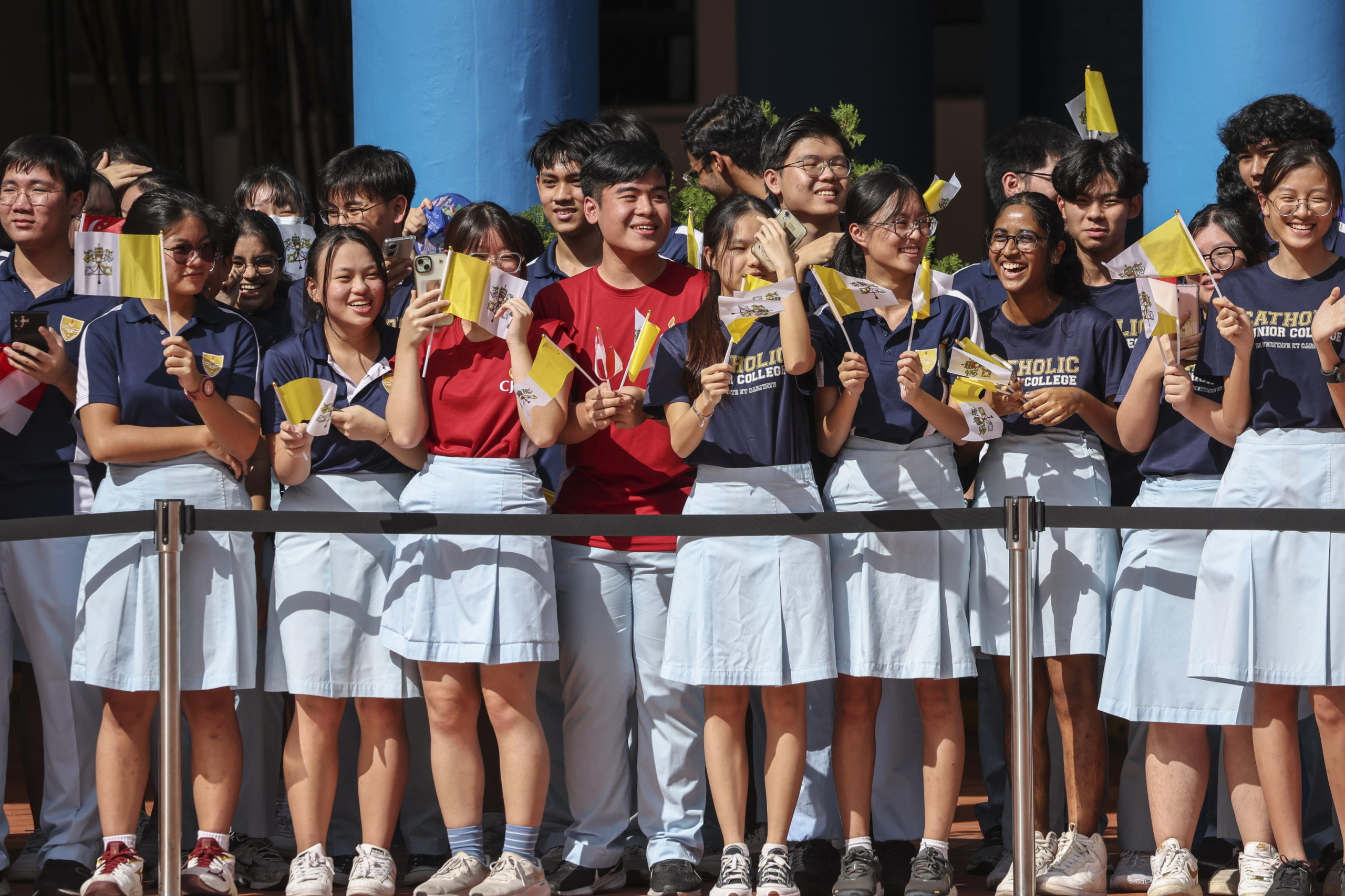 epa11601298 Students prepare for the arrival of Pope Francis (Not Pictured) to an interreligious meeting with young people at the Catholic Junior College in Singapore, 13 September 2024. Pope Francis is visiting Singapore from 11 to 13 September, marking the final stop of his apostolic journey through the Asia-Pacific region, which also included Indonesia, Papua New Guinea, and East Timor.  EPA/HOW HWEE YOUNG