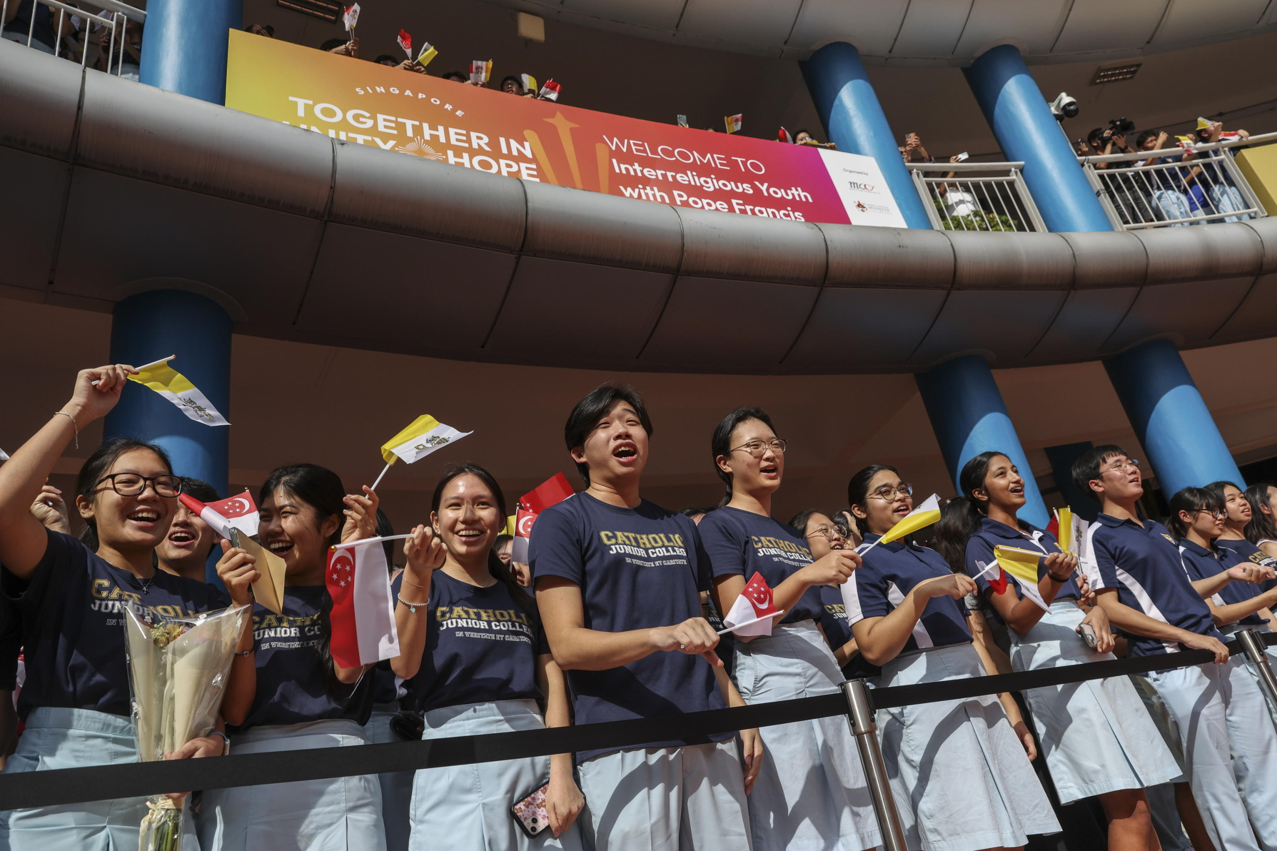 epa11601297 Students prepare for the arrival of Pope Francis (Not Pictured) to an interreligious meeting with young people at the Catholic Junior College in Singapore, 13 September 2024. Pope Francis is visiting Singapore from 11 to 13 September, marking the final stop of his apostolic journey through the Asia-Pacific region, which also included Indonesia, Papua New Guinea, and East Timor.  EPA/HOW HWEE YOUNG