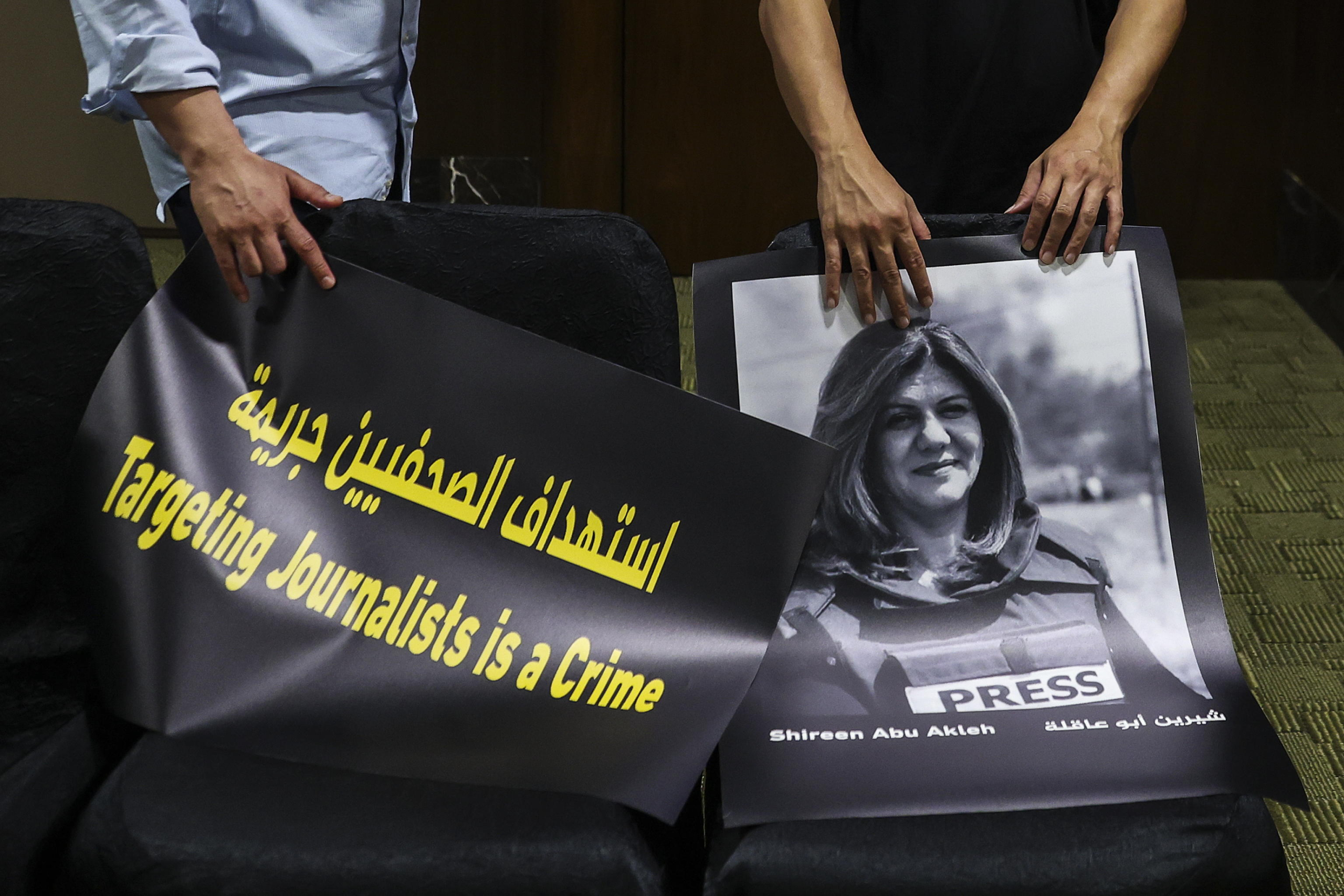 epa11316039 Participants hold a poster reading, 'Targeting Journalist is A Crime', together with poster of Al Jazeera reporter Shireen Abu Akleh who was killed while reporting in Palestine, in conjunction with World Press Freedom Day in Kuala Lumpur, Malaysia, 03 May 2024. According to the Committee to Protect Journalists (CPJ) as of 01 May 2024, CPJ preliminary investigations showed at least 97 journalists and media workers were among the more than 35,000 killed since the war began on 07 October 2023, with more than 34,000 Palestinian deaths in Gaza and the West Bank and 1,200 deaths in Israel.  EPA/FAZRY ISMAIL