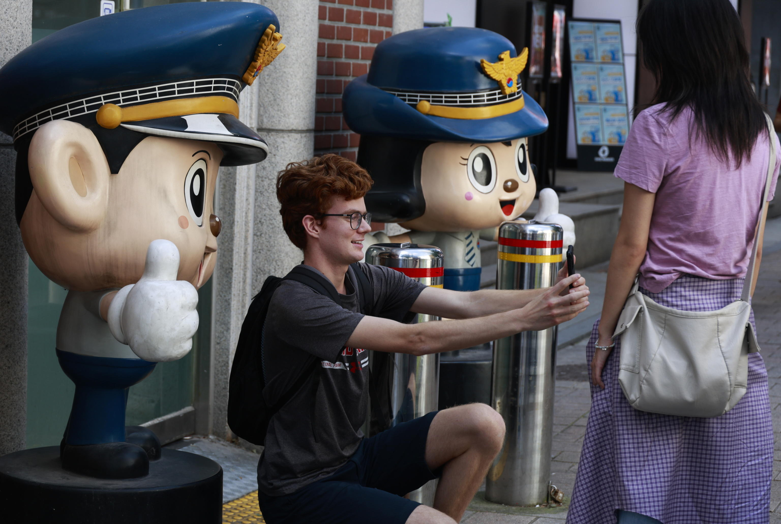 epa11627679 A tourist takes a selfie as he visits the Myeong-dong street on the World Tourism Day in Seoul, South Korea, 27 September 2024.  World Tourism Day has been observed annually since 1980 on 27 September.  EPA/JEON HEON-KYUN