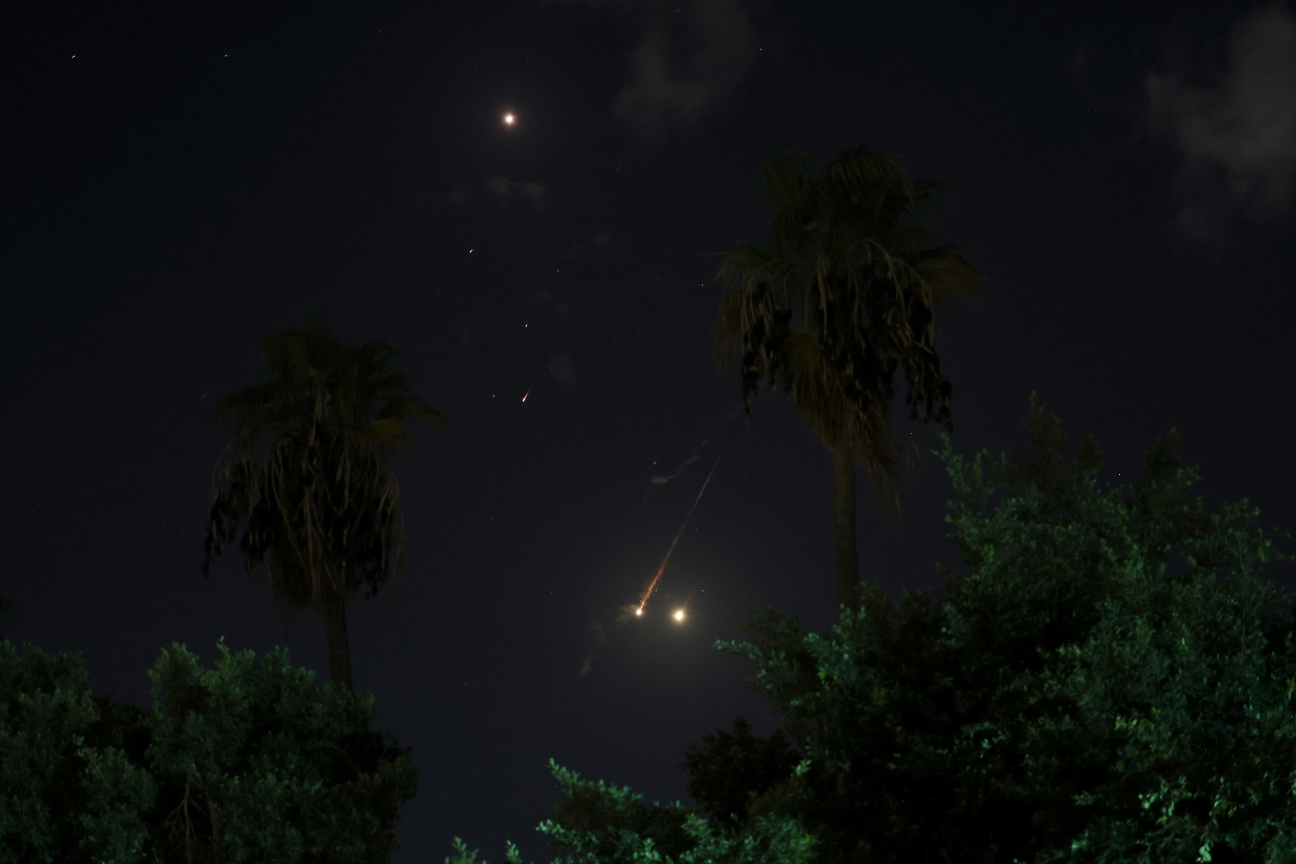 epa11636136 Israel's Iron Dome air defense system intercepts projectiles over Tel Aviv, Israel, 01 October 2024. Israel's military stated that Iran has launched missiles towards the State of Israel on 01 October, and asked citizens to 'remain vigilant' and to follow the Home Front Command's instructions directing people to protected areas and remain there 'until further instructions' are given.  EPA/ABIR SULTAN