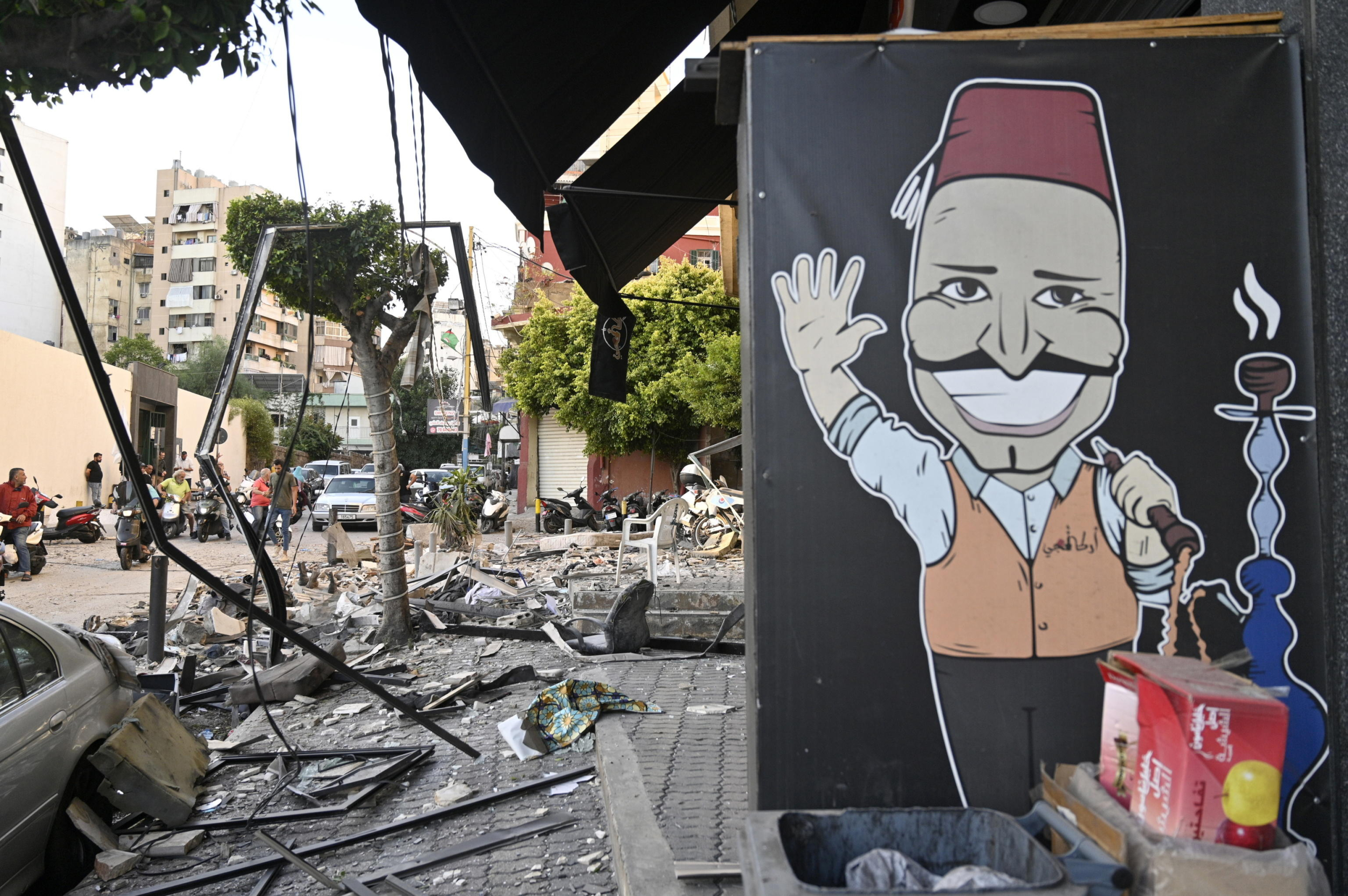 epa11639140 Debris lies on a road following an Israeli airstrike in Beirut's Bachoura neighborhood, Lebanon, 03 October 2024. Lebanese officials reported that an Israeli airstrike on a building in central Beirut resulted in at least five deaths and eight injuries.  EPA/WAEL HAMZEH