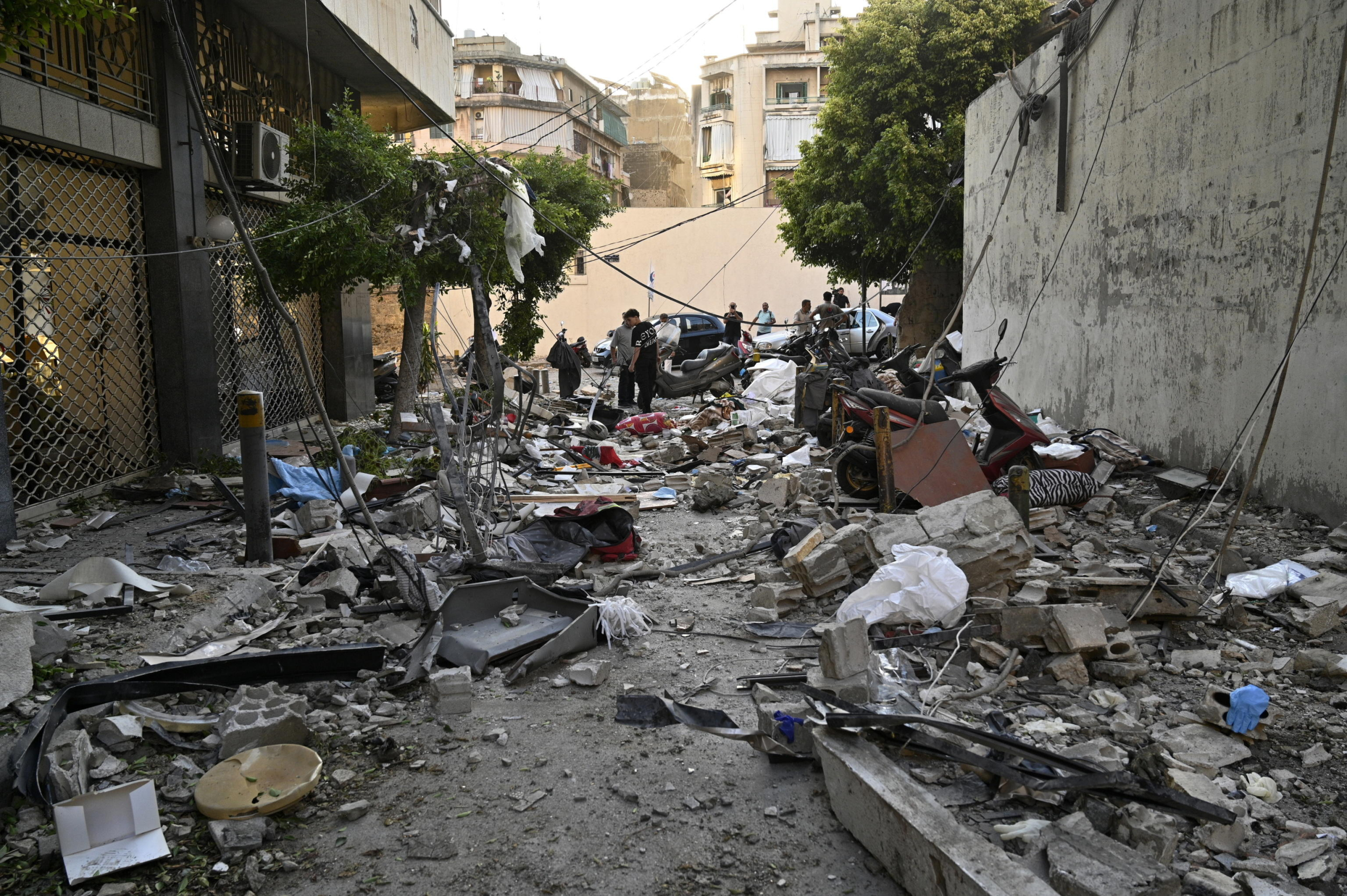 epa11639143 Debris lies on a road following an Israeli airstrike in Beirut's Bachoura neighborhood, Lebanon, 03 October 2024. Lebanese officials reported that an Israeli airstrike on a building in central Beirut resulted in at least five deaths and eight injuries.  EPA/WAEL HAMZEH