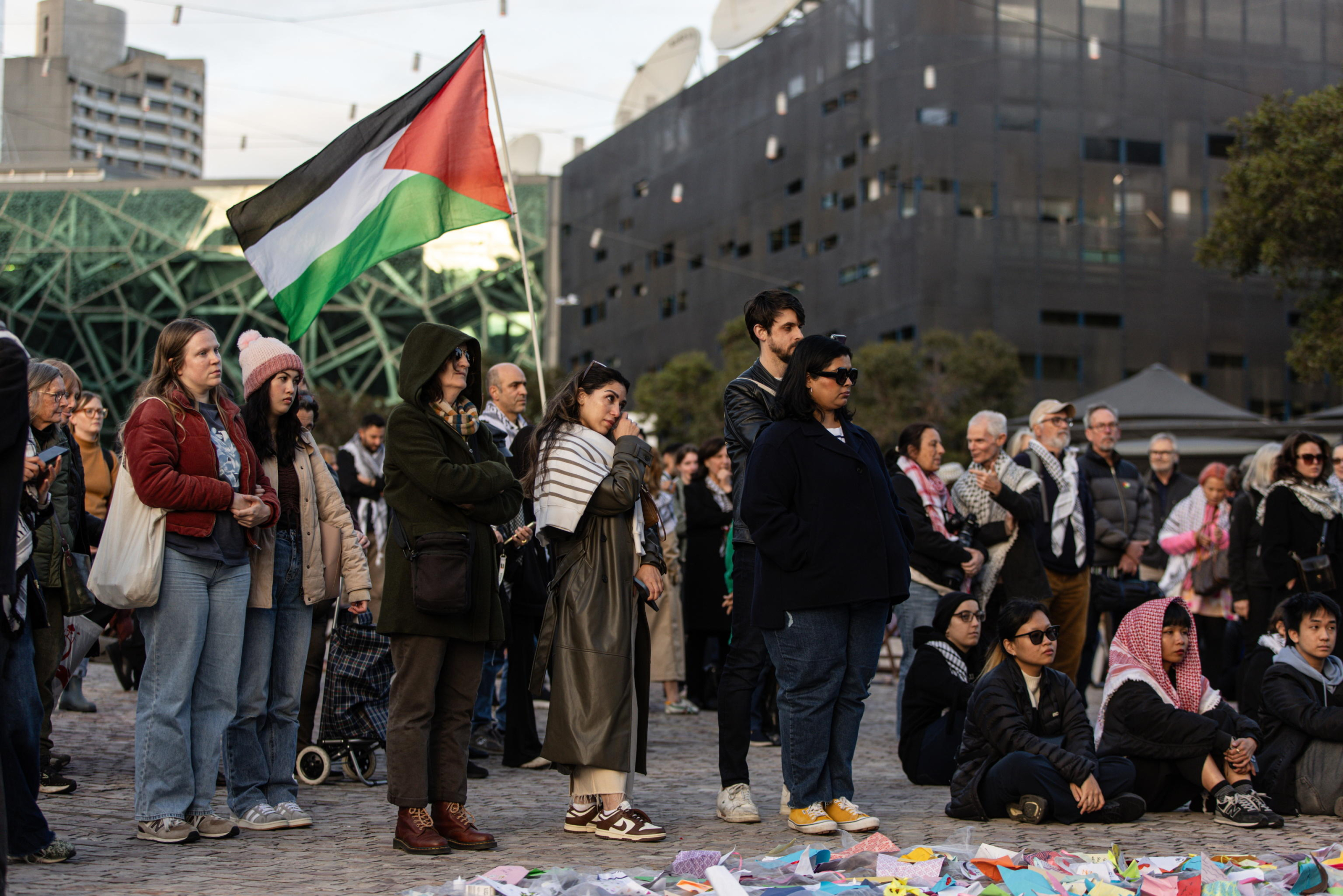 epa11654327 Community members gather for a Free Palestine Melbourne vigil to remember victims of the Gaza attacks at Federation Square in Melbourne, Australia, 11 October 2024. A Free Palestine Melbourne vigil is taking place at Federation Square, where community members are gathering to remember victims of Israeli attacks in Gaza.  EPA/DIEGO FEDELE AUSTRALIA AND NEW ZEALAND OUT