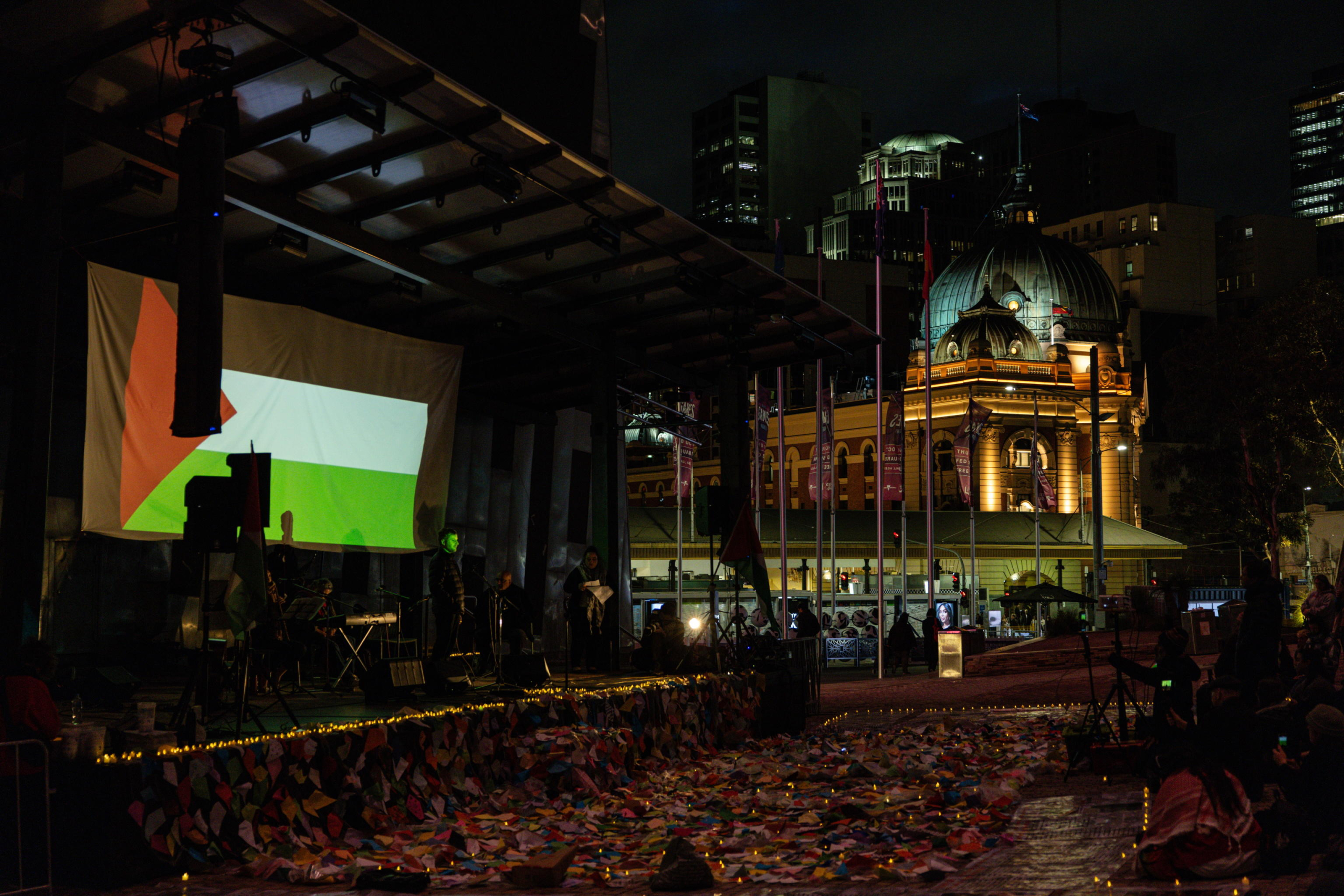 epa11654328 Community members gather for a Free Palestine Melbourne vigil to remember victims of the Gaza attacks at Federation Square in Melbourne, Australia, 11 October 2024. A Free Palestine Melbourne vigil is taking place at Federation Square, where community members are gathering to remember victims of Israeli attacks in Gaza.  EPA/DIEGO FEDELE AUSTRALIA AND NEW ZEALAND OUT