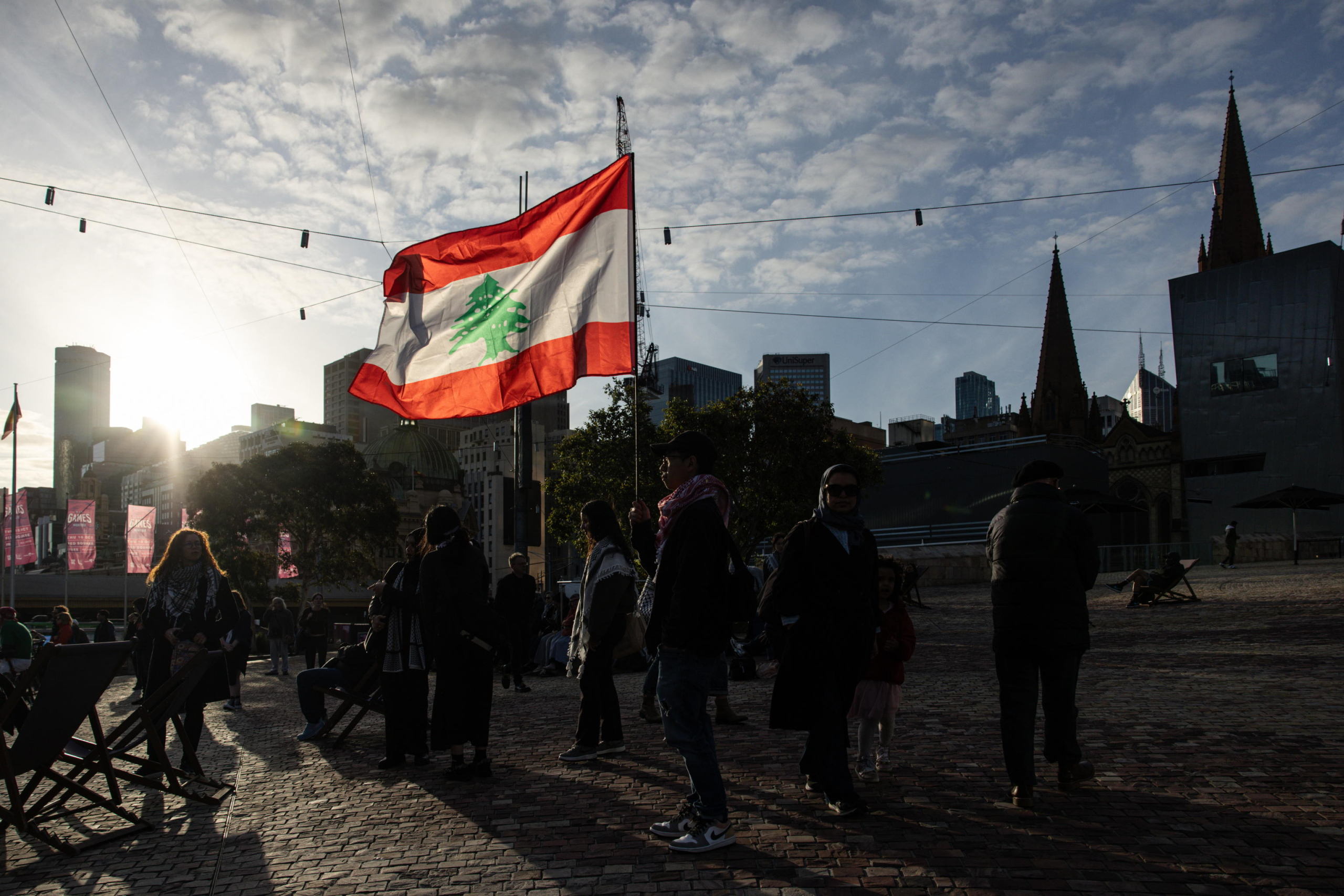 epa11654325 Community members gather for a Free Palestine Melbourne vigil to remember victims of the Gaza attacks at Federation Square in Melbourne, Australia, 11 October 2024. A Free Palestine Melbourne vigil is taking place at Federation Square, where community members are gathering to remember victims of Israeli attacks in Gaza.  EPA/DIEGO FEDELE AUSTRALIA AND NEW ZEALAND OUT